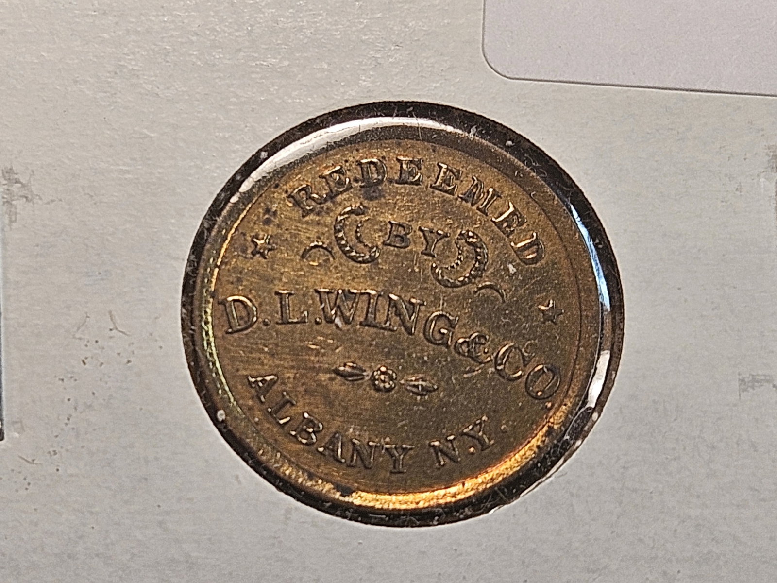 Civil War Merchants Token from Albany, New York: Redeemed by D.L. Wing and Co.