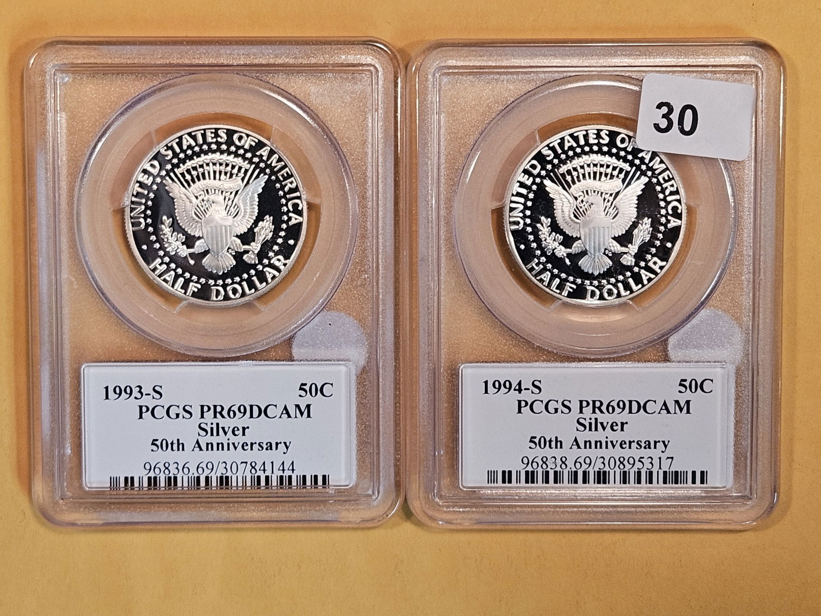 Two PCGS-graded Silver Kennedy Half Dollars in Proof 69 Deep Cameo (1 of 2)