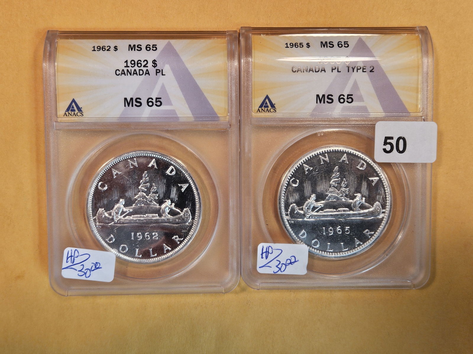 Two ANACS-graded Prooflike Canada Silver Dollars (1 of 2)