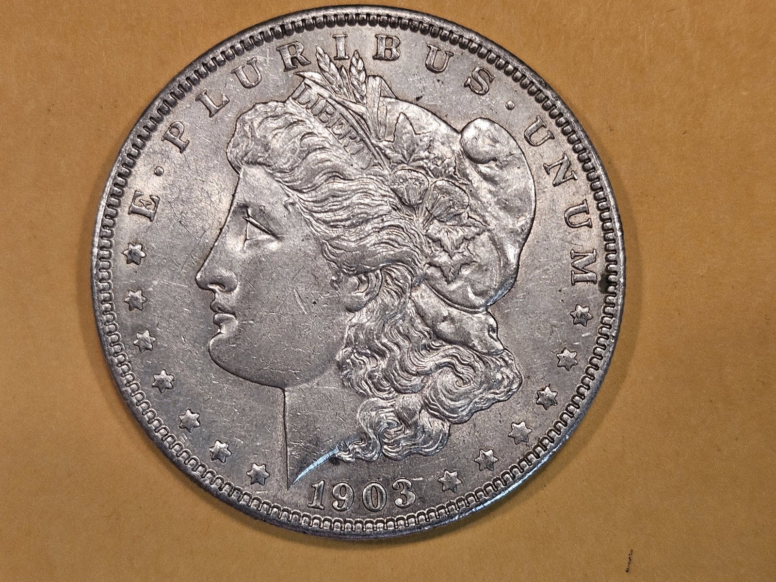 1903 Morgan Dollar in About Uncirculated - 50: Good luster