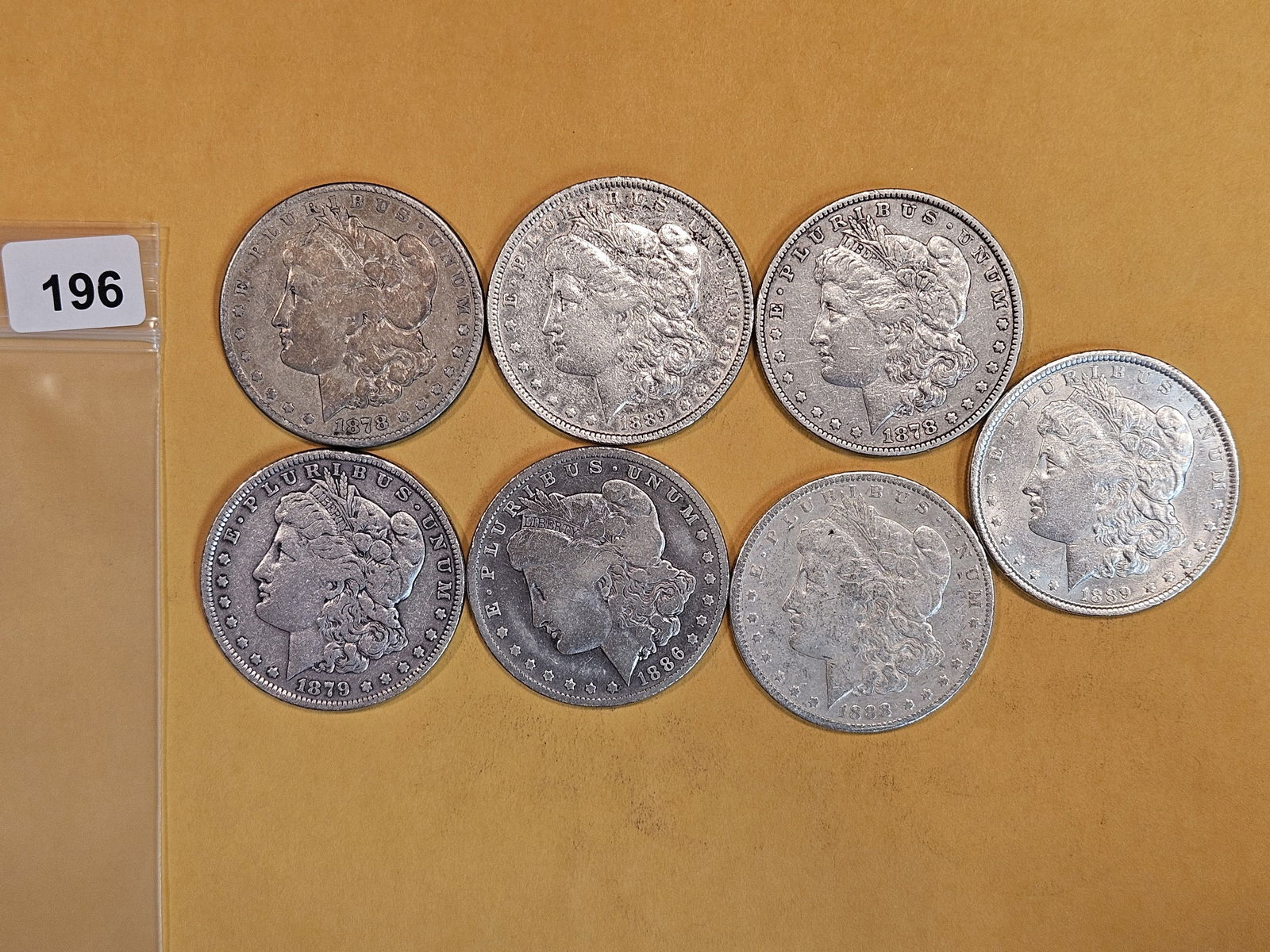 Seven mixed Morgan silver Dollars (1 of 2)