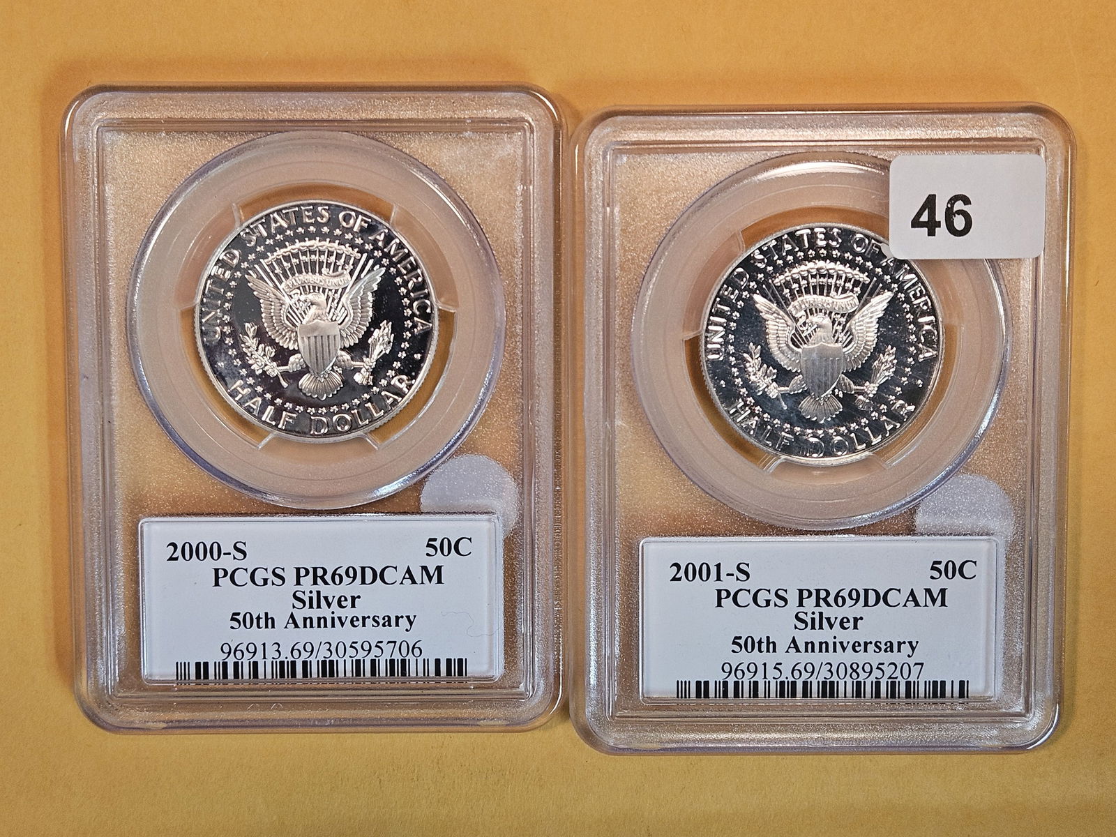 Two near-perfect, PGCS-graded Silver Kennedy Half Dollars: Both in Proof 69 Deep Cameo. Both SILVER