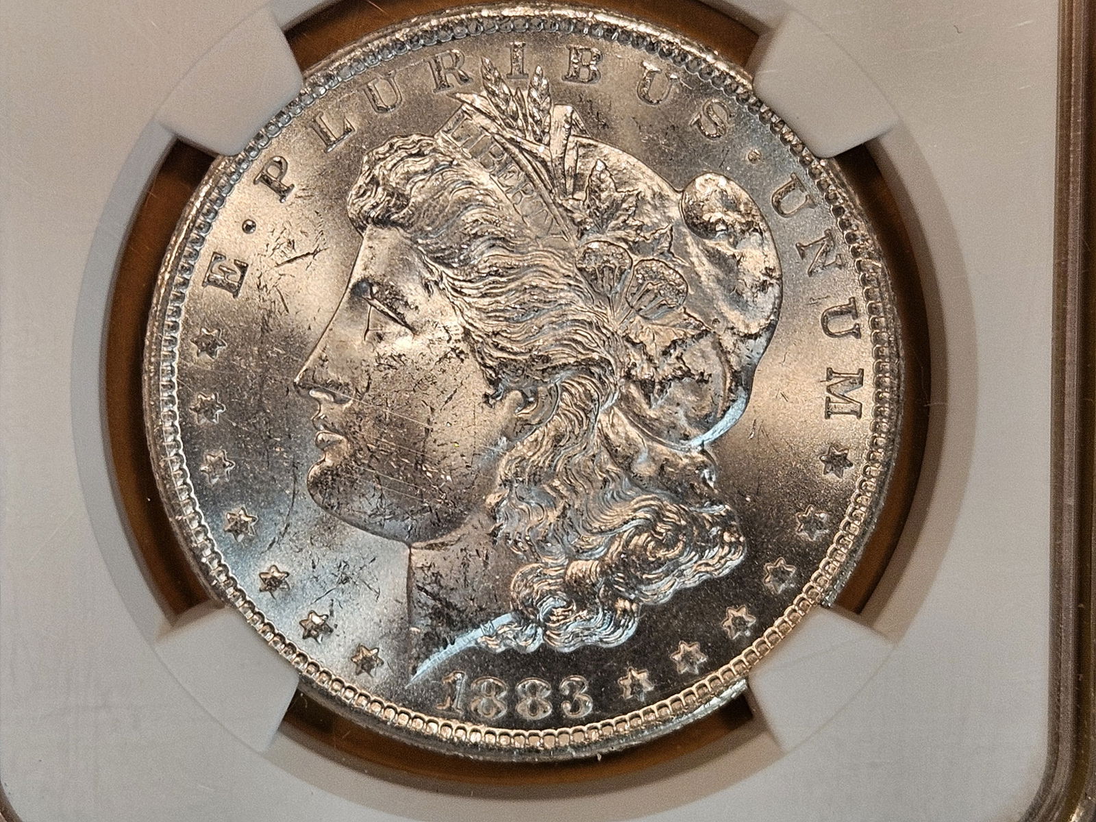 ** KEY DATE ** NGC 1883-CC Morgan Dollar in Mint State 62 (1 of 4)