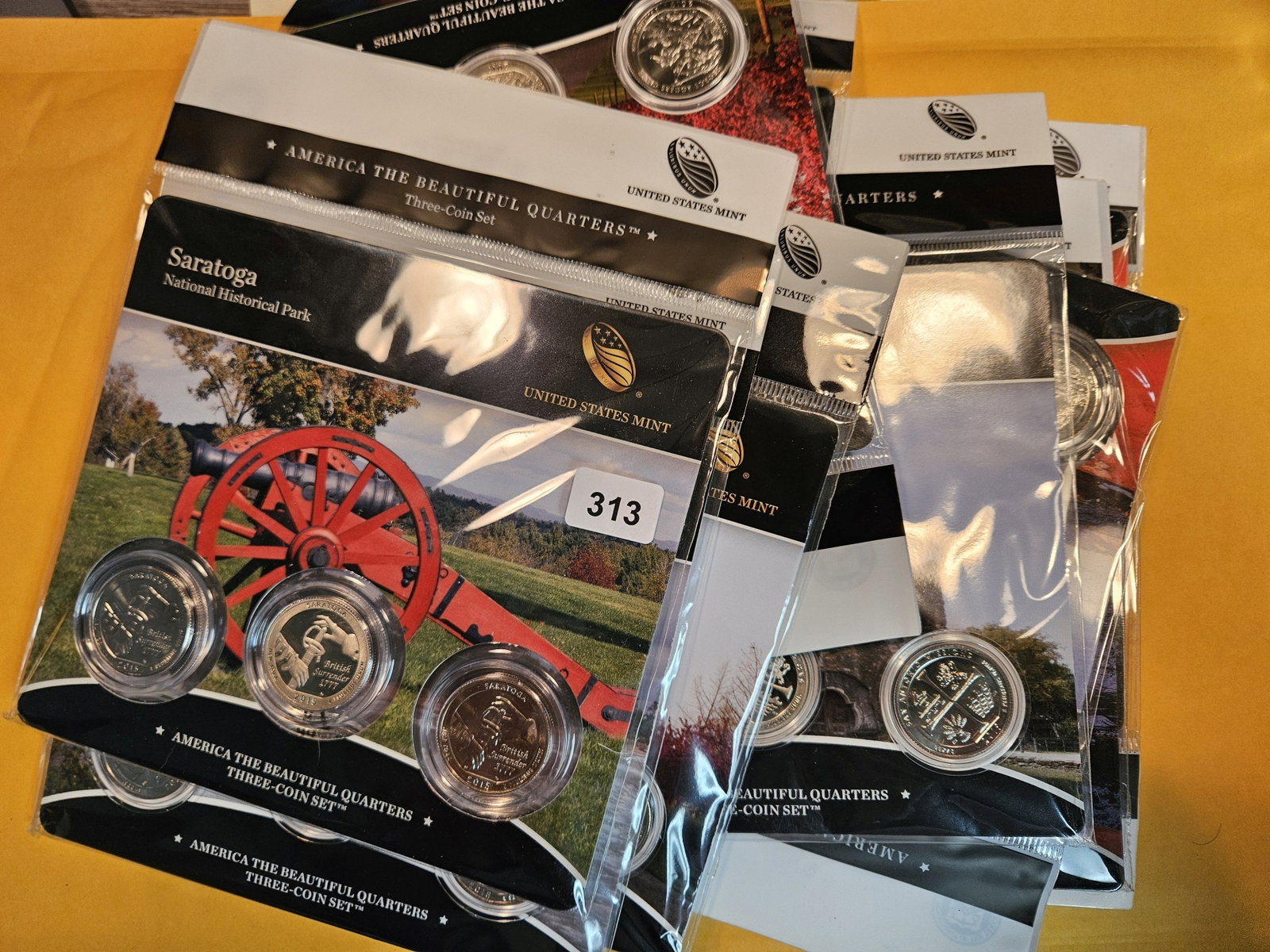 TEN US MINT America the Beautiful 3-coin Quarters Sets: In original government packaging with certificate of authenticity
