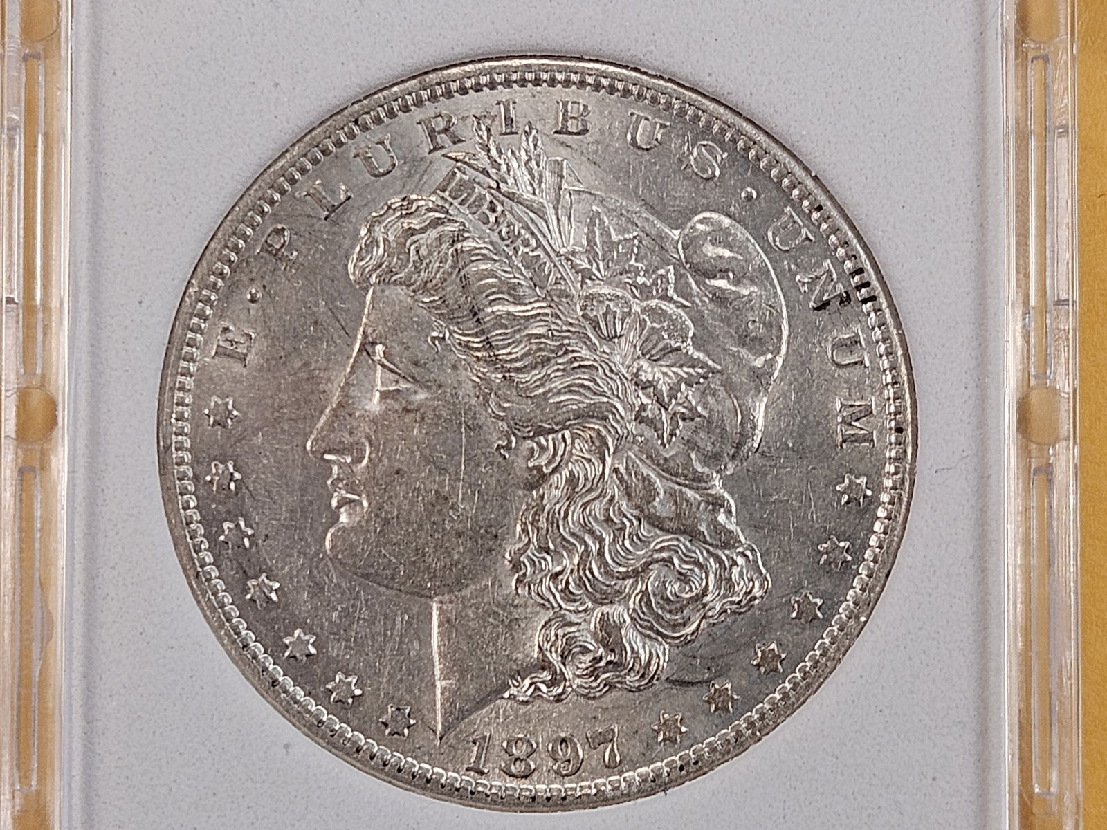 Slabbed 1897 Morgan Silver Dollar: Brilliant About Uncirculated to Brilliant Uncirculated 