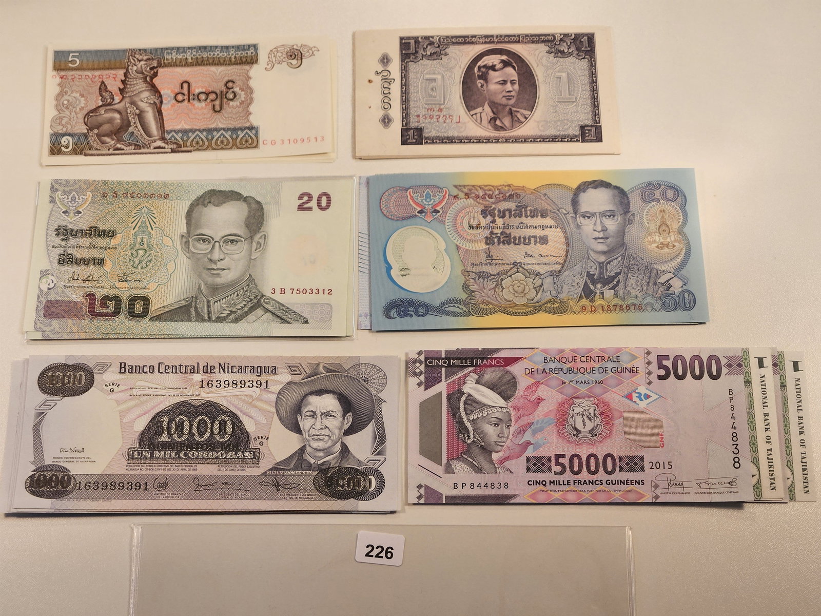 Four Stacks of Crisp Uncirculated Foreign Notes (1 of 7)