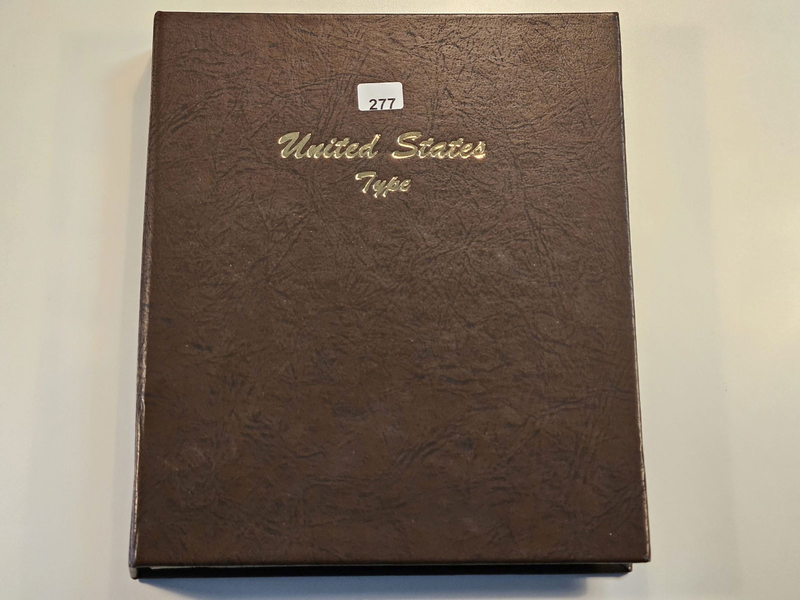 Partially Filled United States Type Dansco Album with Silver: 1943-D Wartime Silver Nickel, 1941-D Mercury and 1960-D Roosevelt Silver Dimes, a Washington Silver Quarter, a 1970 Kennedy, 1976-S Kennedy Silver Half Dollar and Eisenhower Silver Dollar. With a few