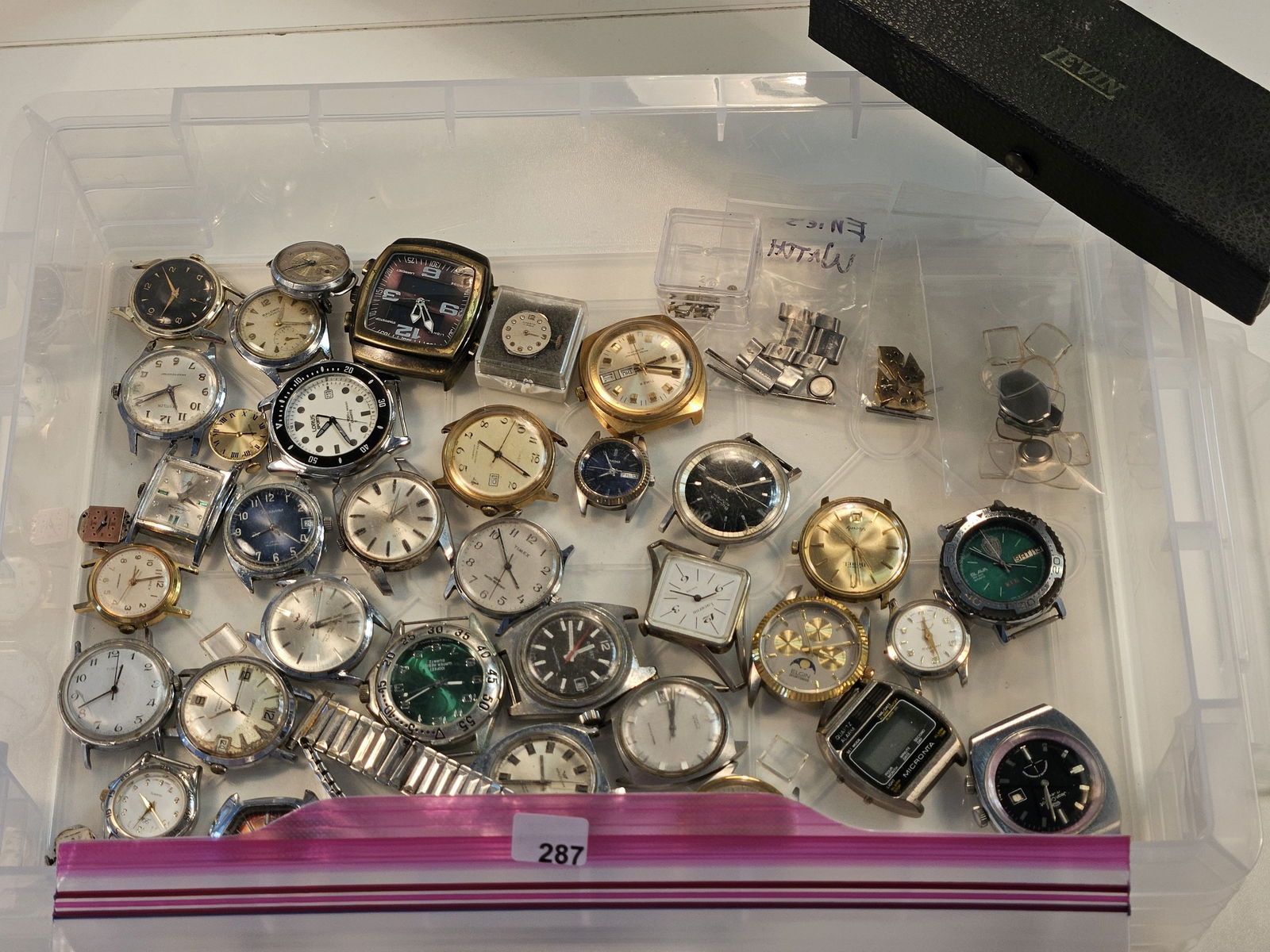 WATCH REPAIR LOT! Parts and Pieces: Thirty-four watch faces, mixed parts including bands, screws, links, and glass. With a watch repair tool 