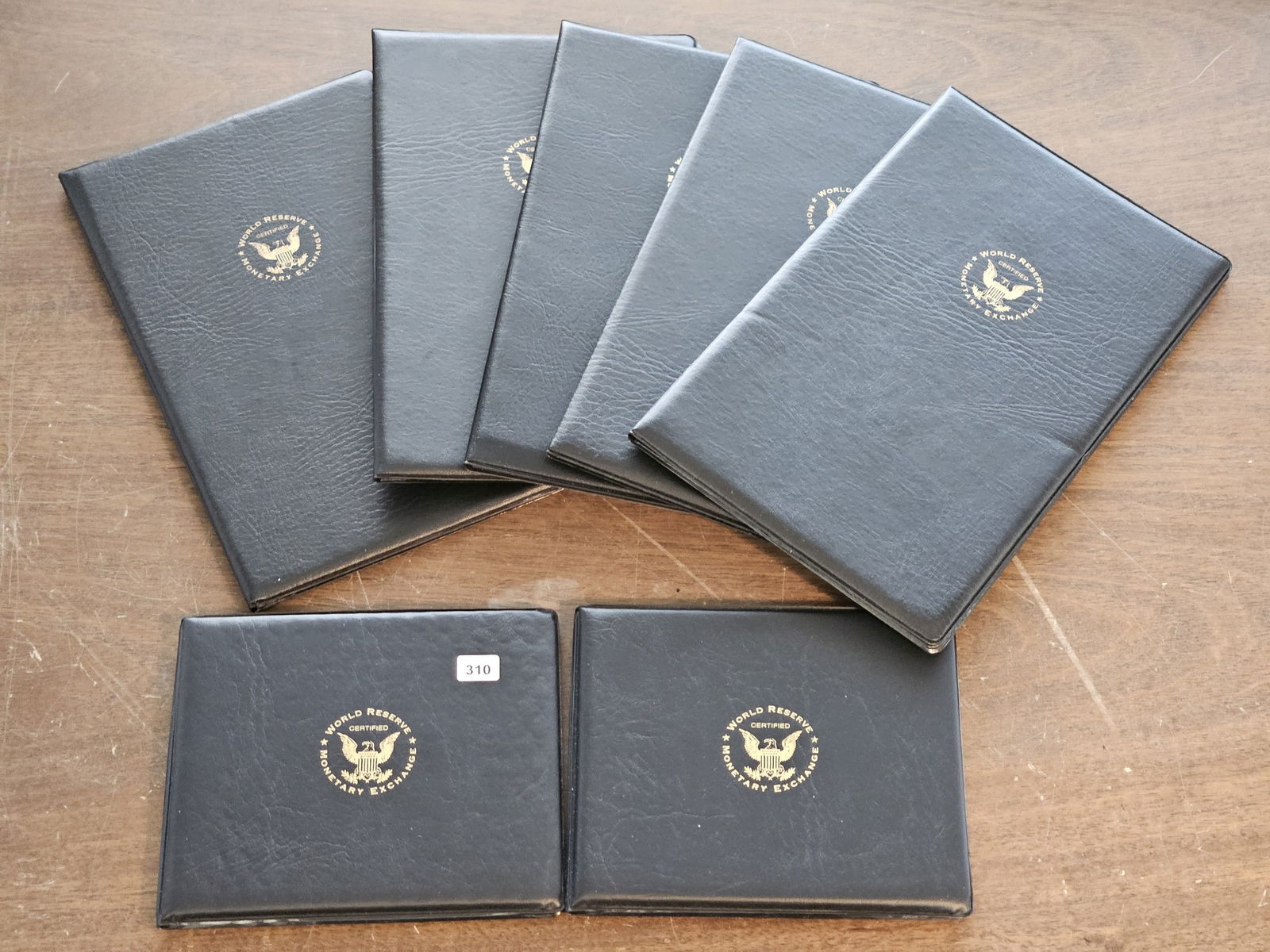 Five Uncut Note Sets and two Red Seal Currency Sets from the World Reserve Monetary Exchange: Two sheets of uncut $1 Dollar Federal Reserve Notes, two sheets of $2 Dollar Federal Reserve Notes and one sheet of uncut $5 Dollar Federal Reserve Notes. Red Seal $2 and $5 Dollar United States