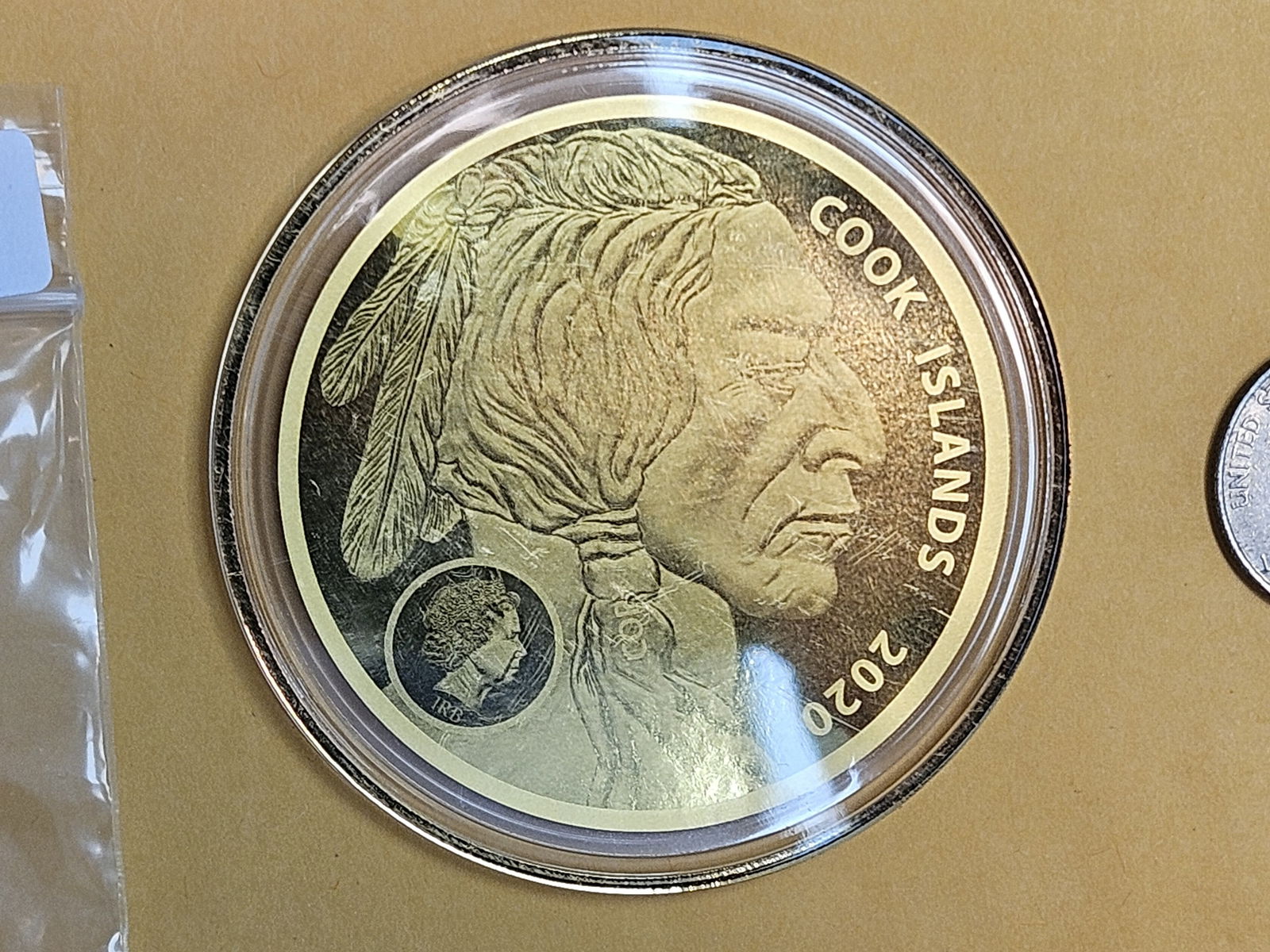 GOLD! GEM Proof 2020 Cook Islands Gold Twenty-Five Dollars: A Tribute to the United States. The quarter next to it is there for size reference….no extra coins come with the gold coin. 