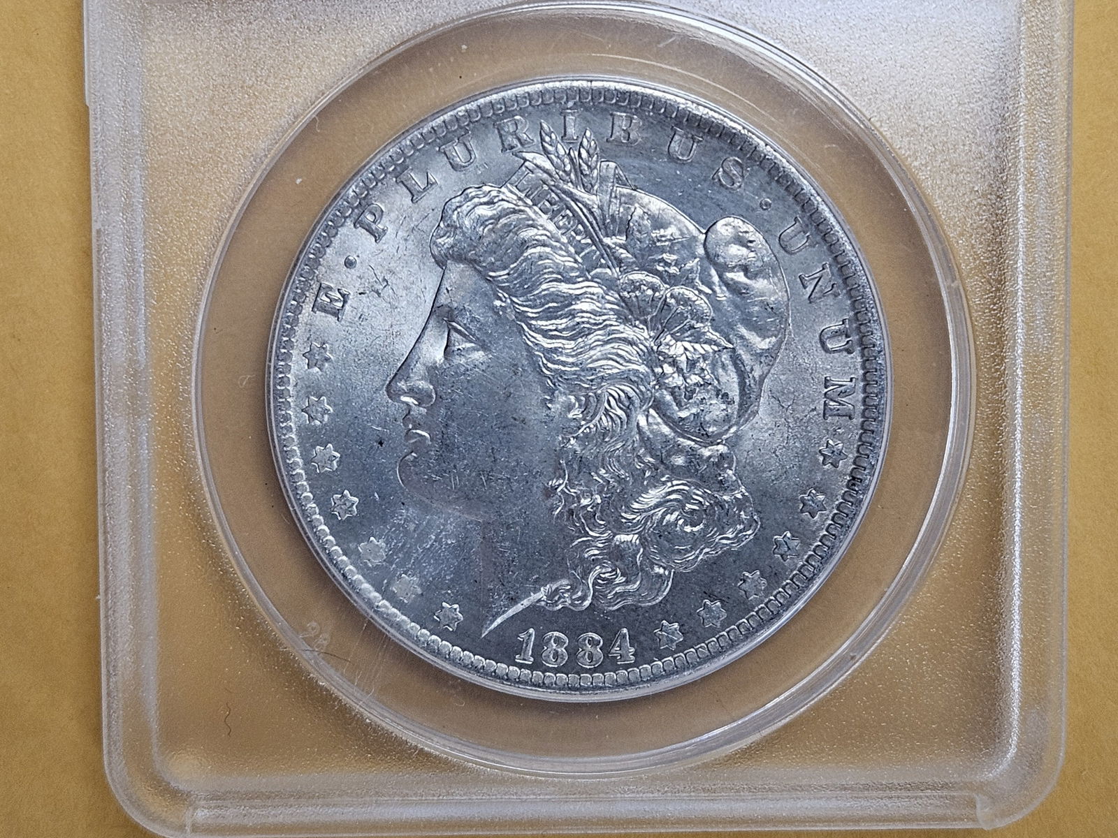 ANACS 1884-O Morgan silver Dollar in Mint State 63 (1 of 3)