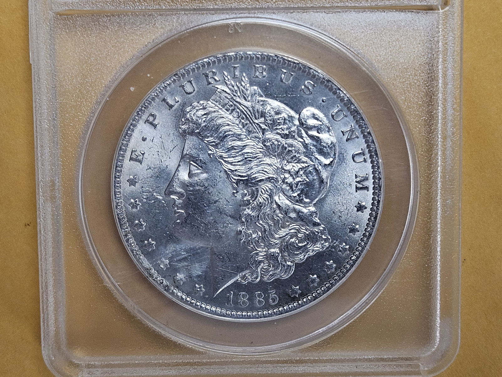 ANACS 1885-O Morgan silver Dollar in Mint State 63 (1 of 3)