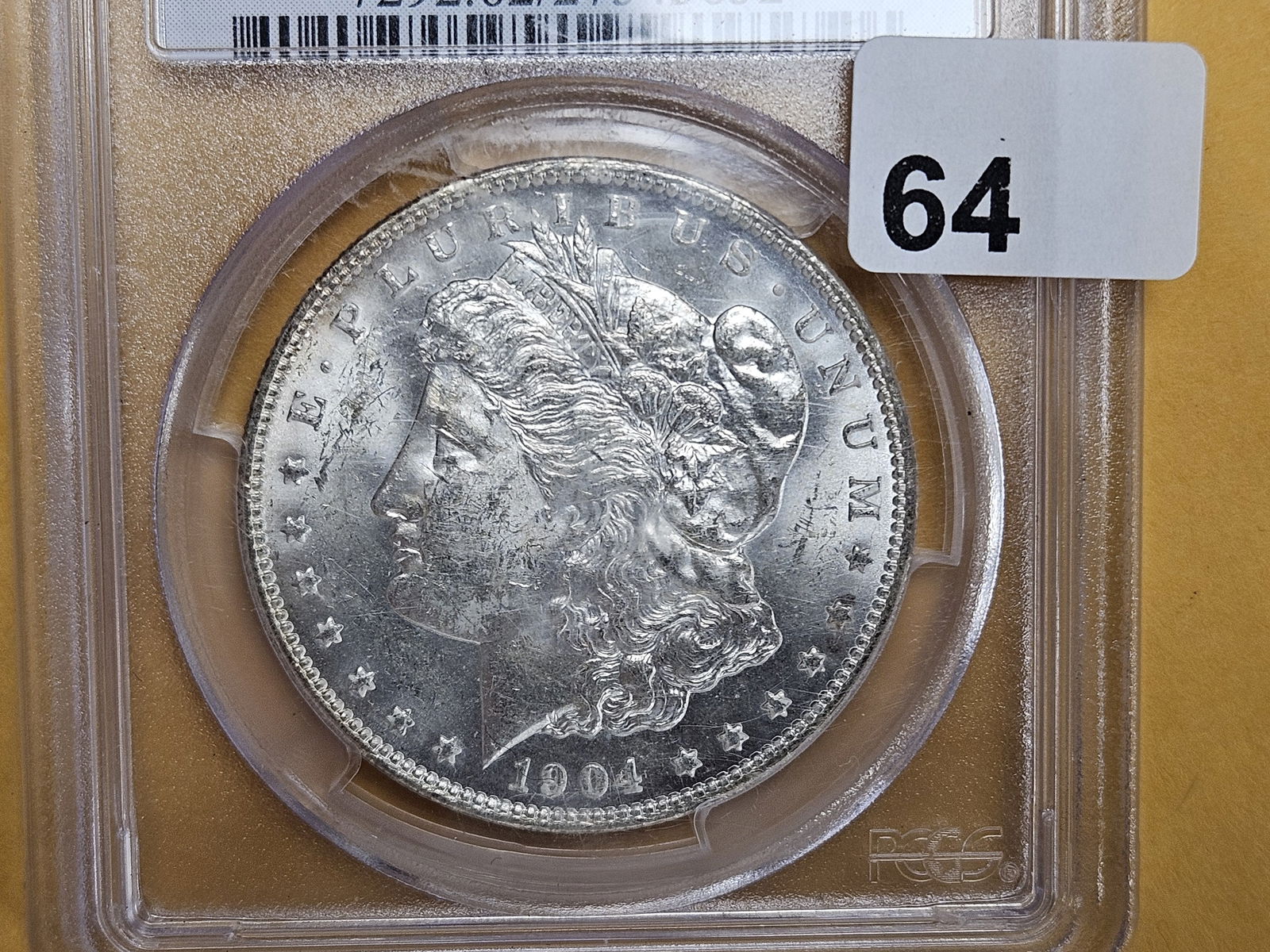 PCGS 1904-O Morgan Dollar in Mint State 62 (1 of 3)