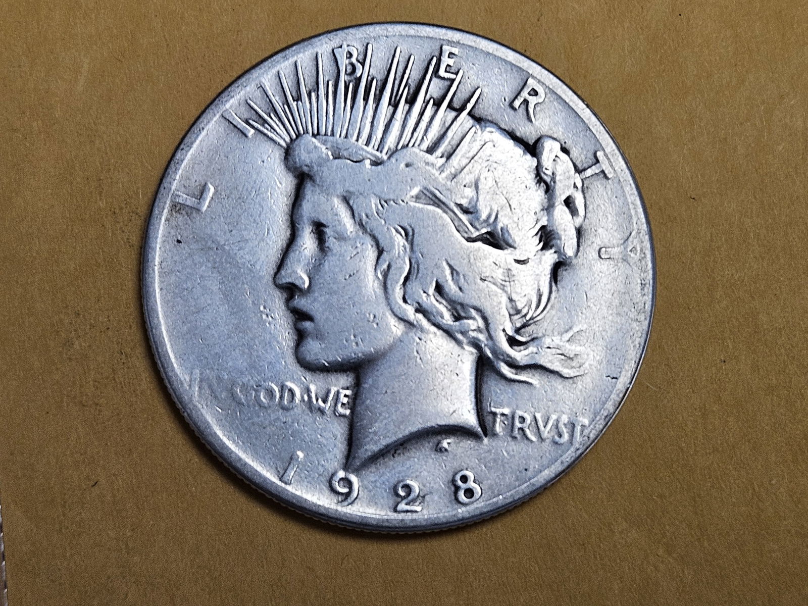** KEY DATE ** 1928 Peace silver Dollar in Very Good - details (1 of 3)
