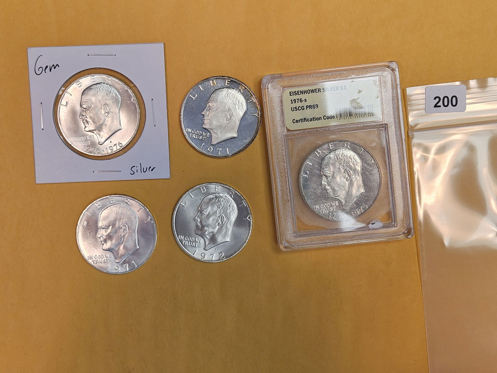 Five mixed Eisenhower SILVER Dollars (1 of 5)