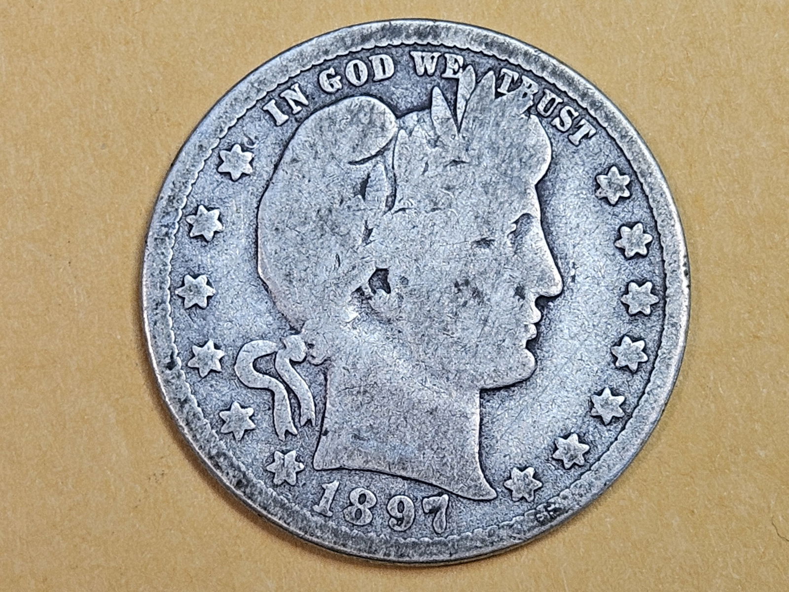 Semi-key 1897-O Barber Quarter in Good plus: Even wear 