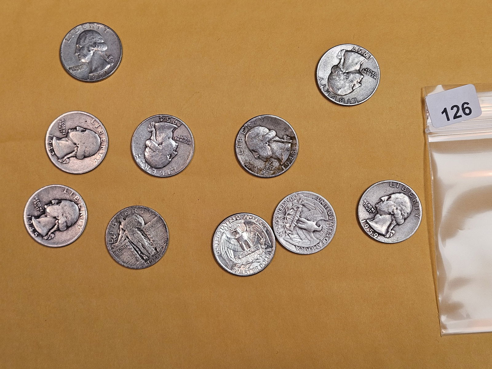 Ten mixed silver Quarters: Mixed dates and grades 