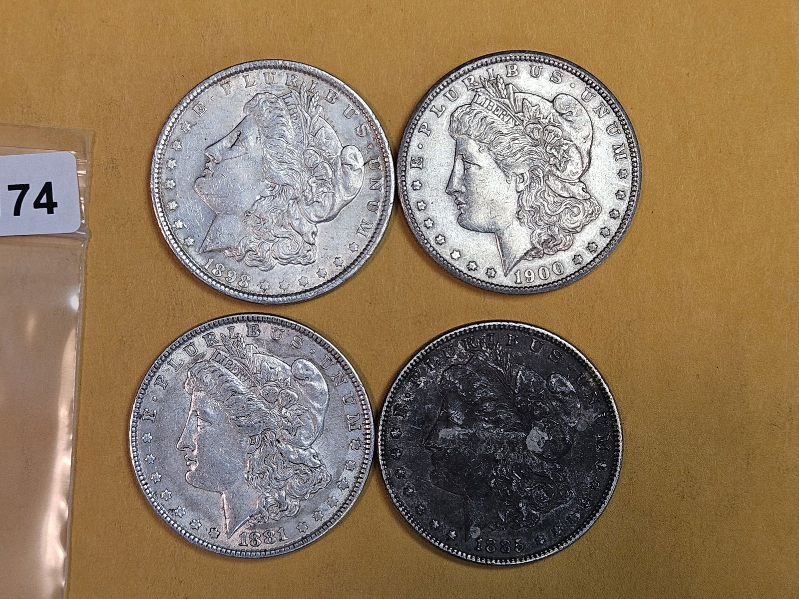 Four About Uncirculated Morgan Silver Dollars (1 of 3)