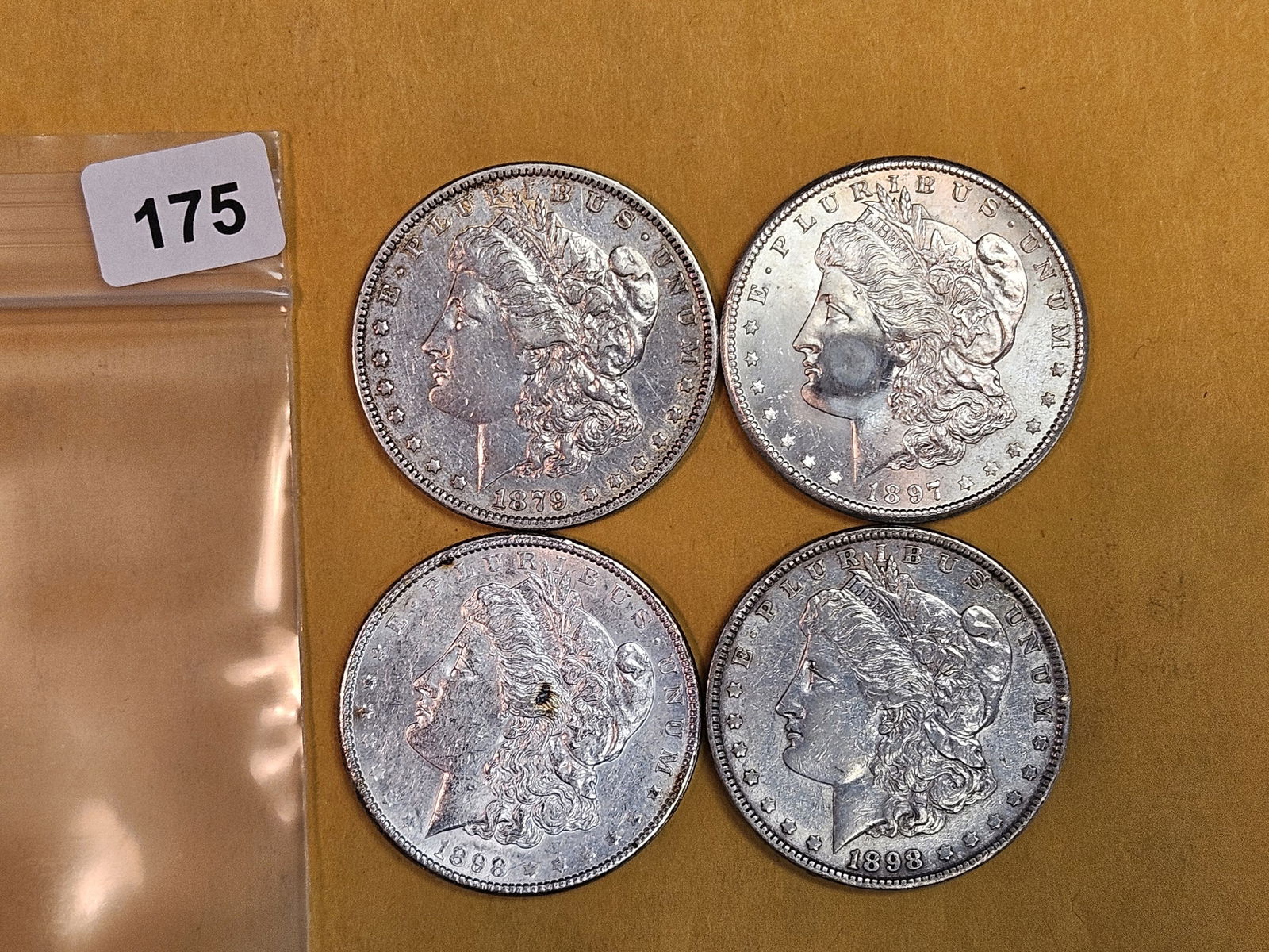 Four About Uncirculated Morgan Silver Dollars (1 of 3)