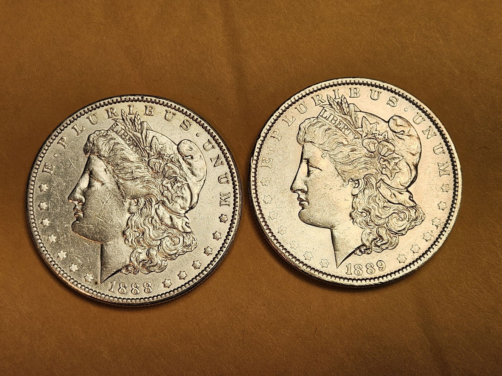 Two Brilliant About Uncirculated plus Morgan silver Dollars (1 of 3)