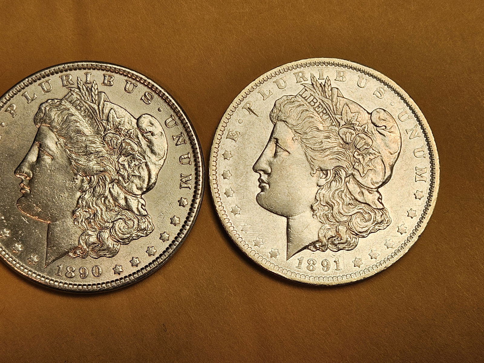 Two Brilliant About Uncirculated plus Morgan silver Dollars (1 of 3)