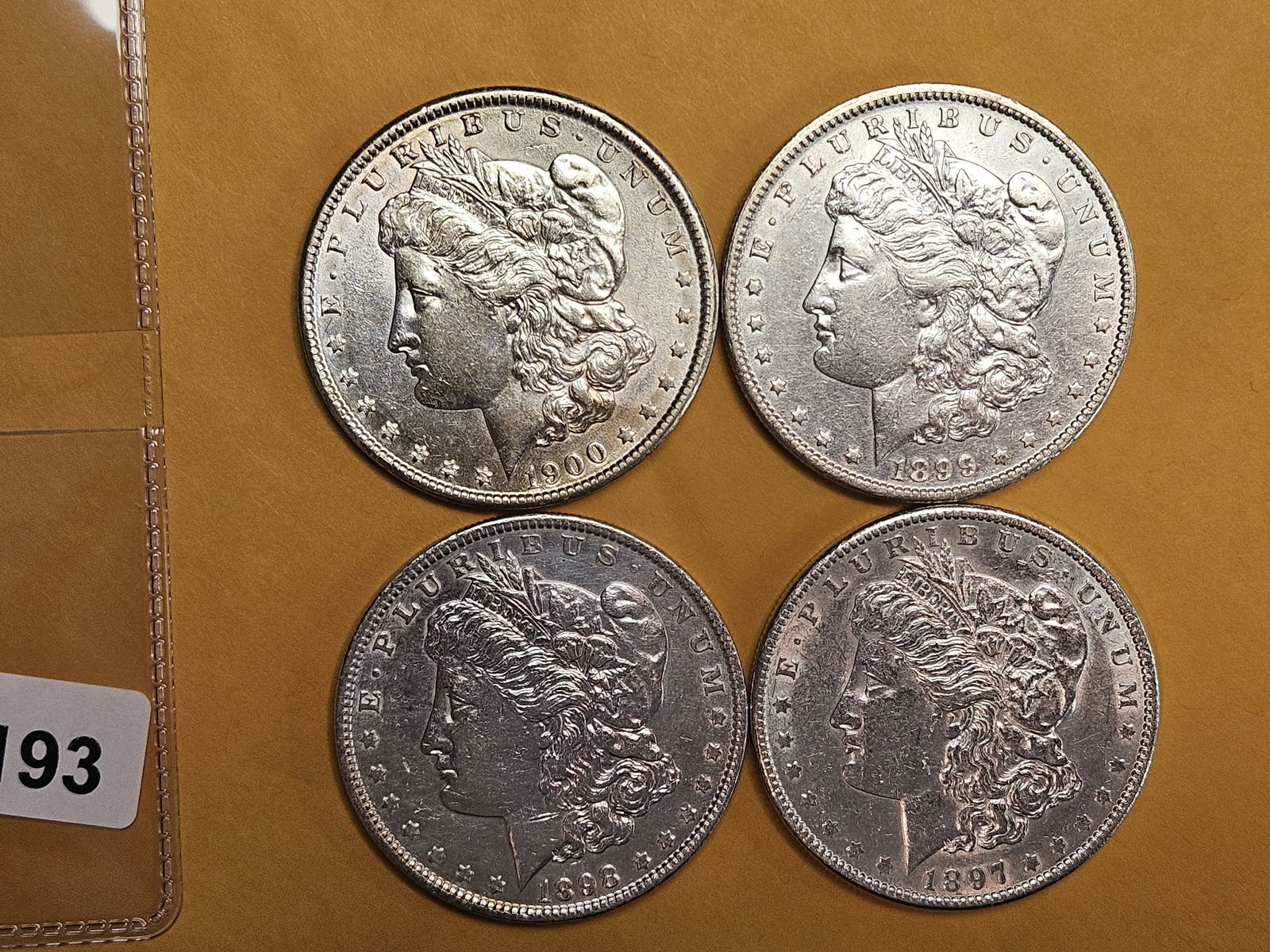 Four Brilliant About Uncirculated plus Morgan silver Dollars (1 of 3)