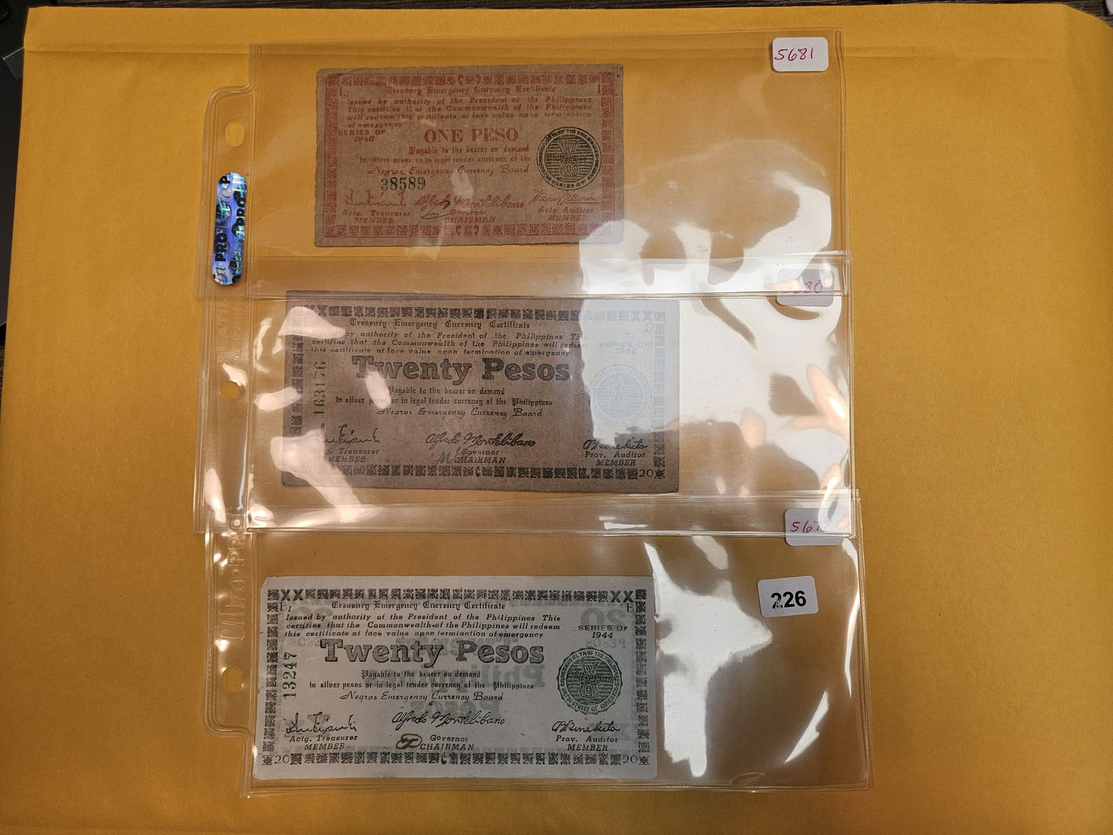 One, twenty and twenty Peso notes: Treasury Emergency Currency Certificates 