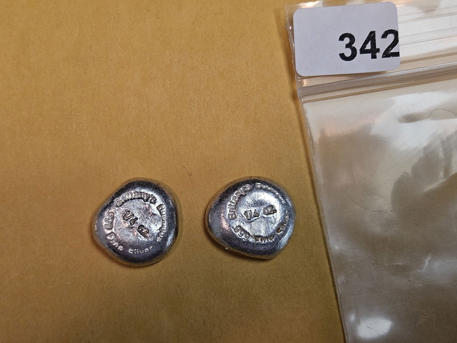 TWO .999 fine poured silver pieces: Both are one-quarter troy ounce 