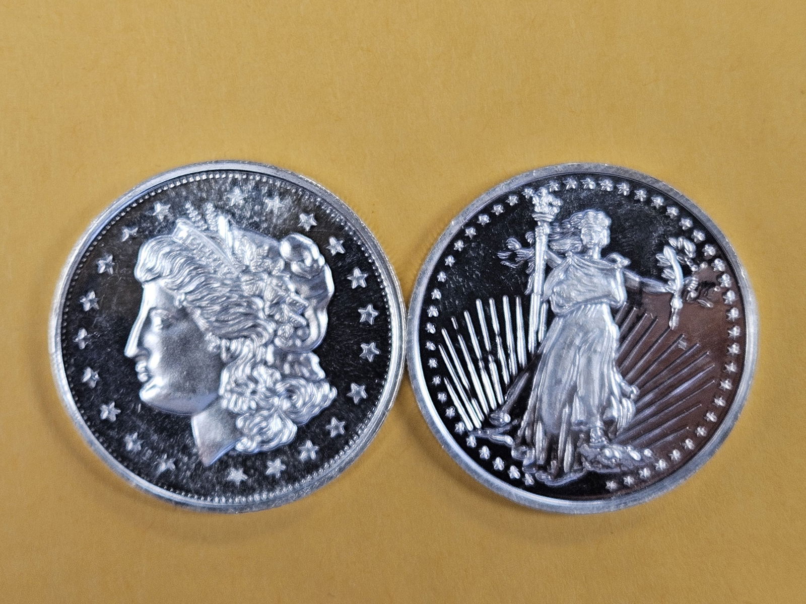 Two 1-troy ounce .999 fine silver art rounds: Mixed 