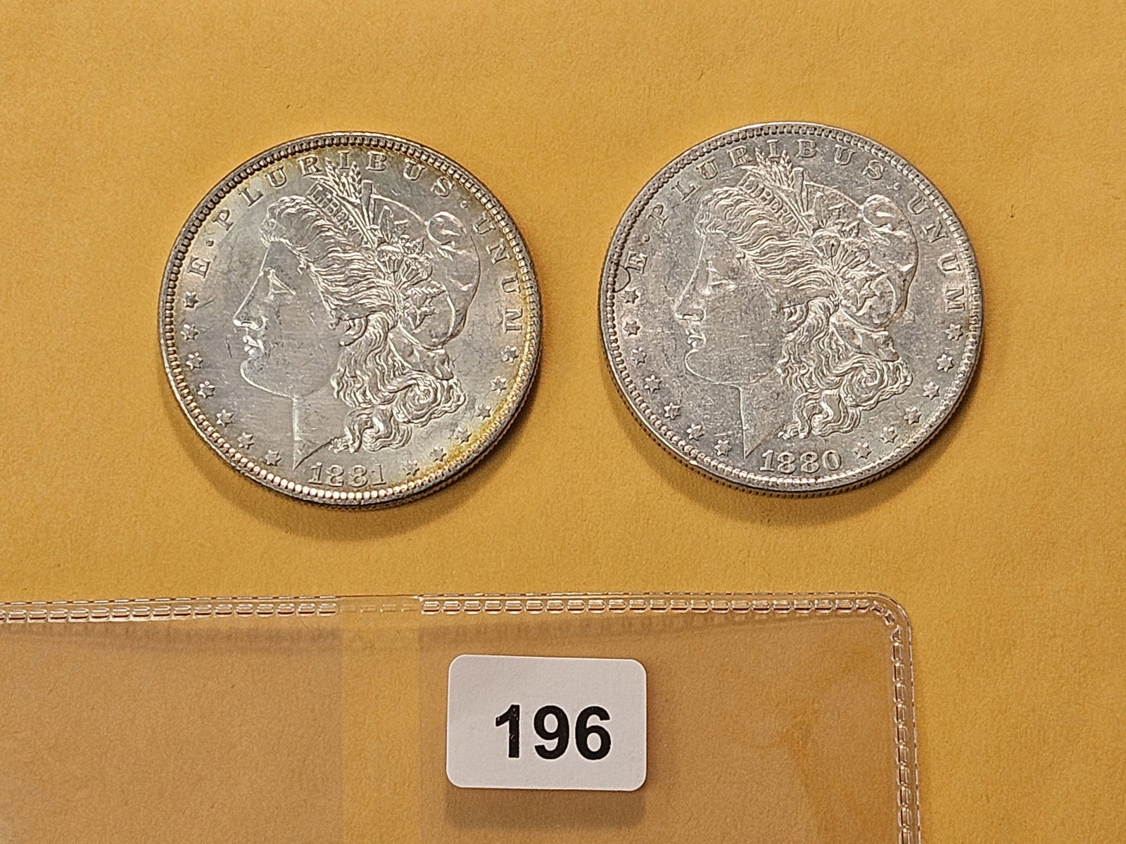 Two About Uncirculated Morgan Silver Dollars (1 of 4)