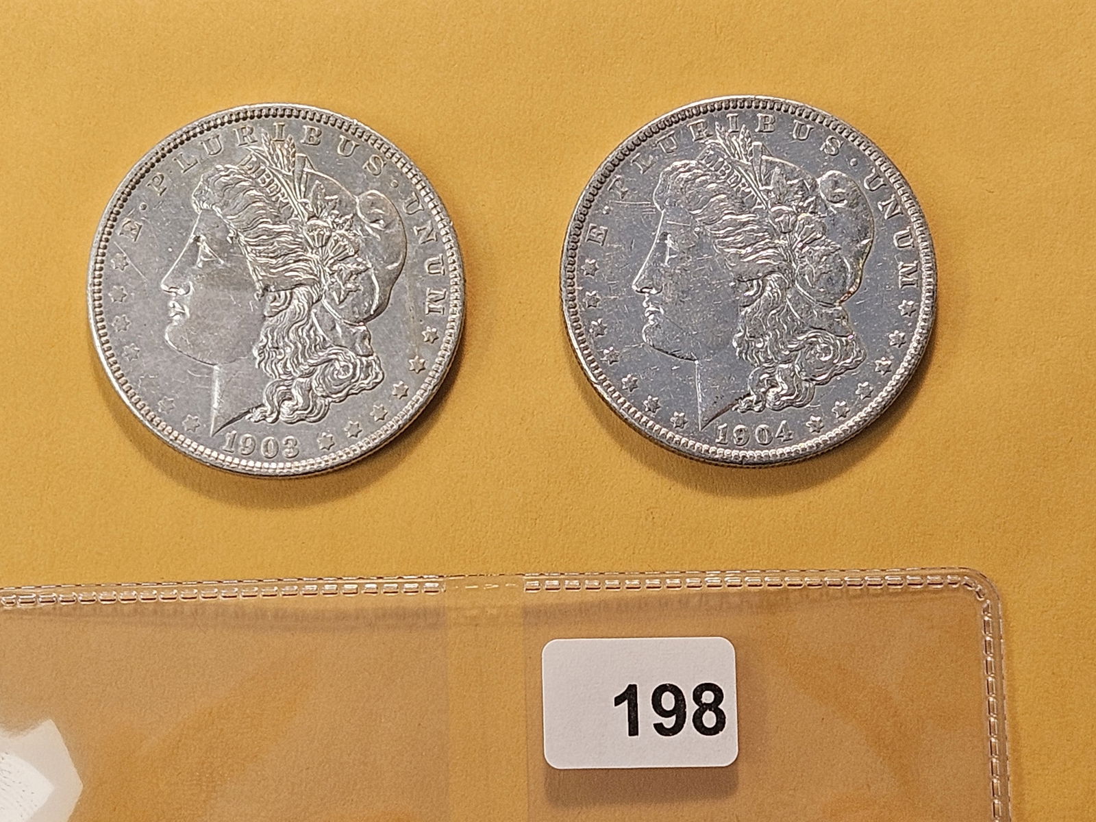 Two About Uncirculated Morgan Silver Dollars (1 of 4)