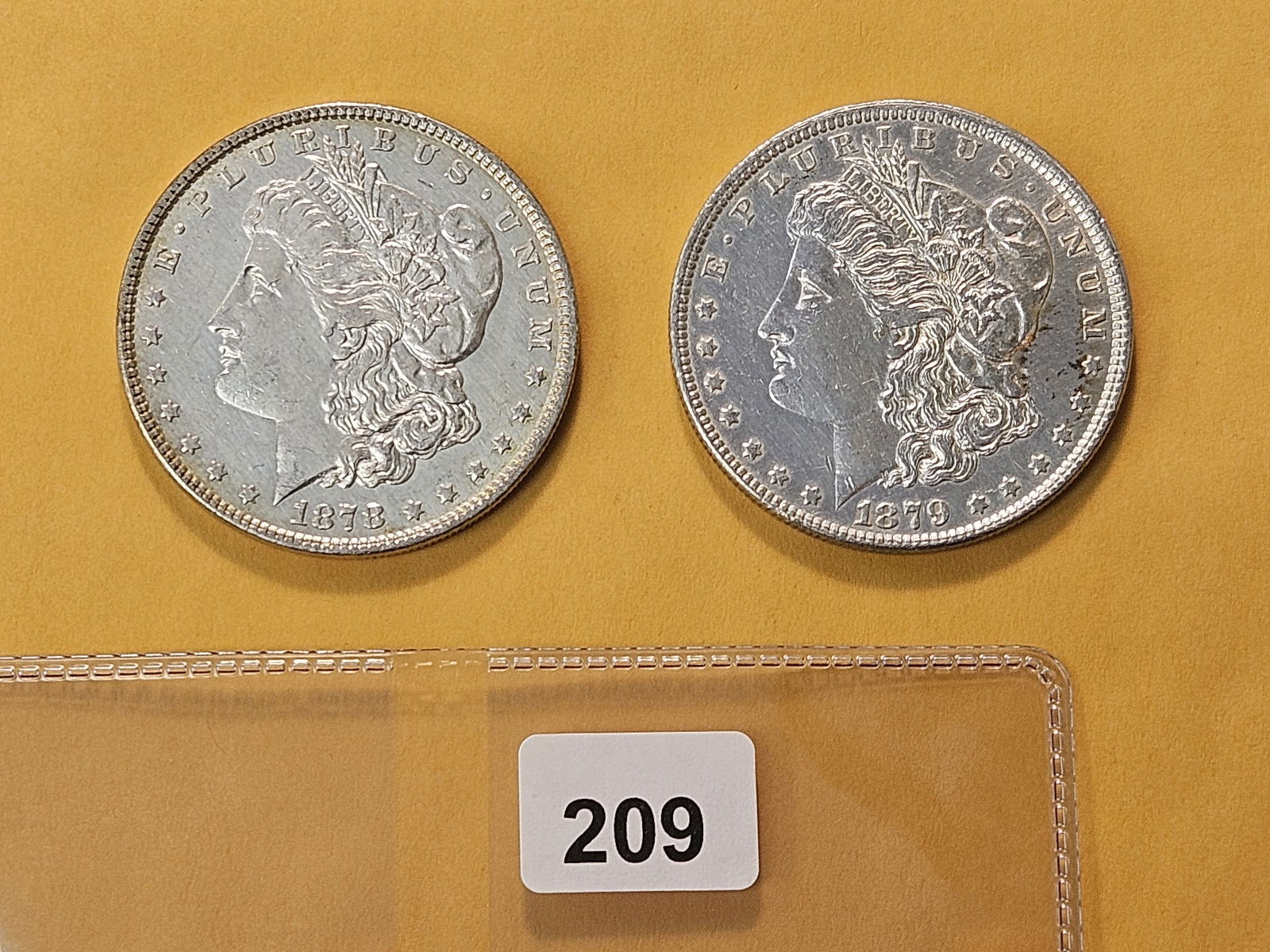 Two About Uncirculated Morgan Silver Dollars (1 of 4)