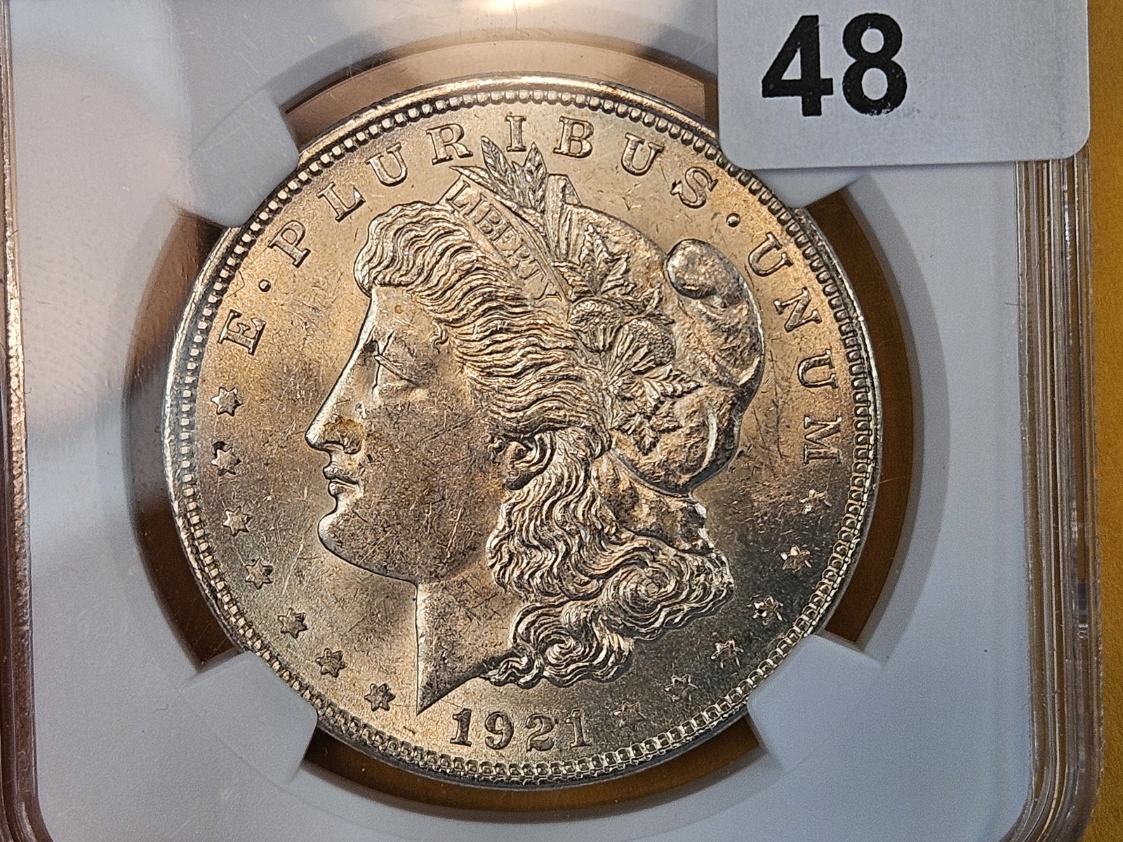 NGC 1921 Morgan Dollar: Last Year of Issue. Lightly toned 