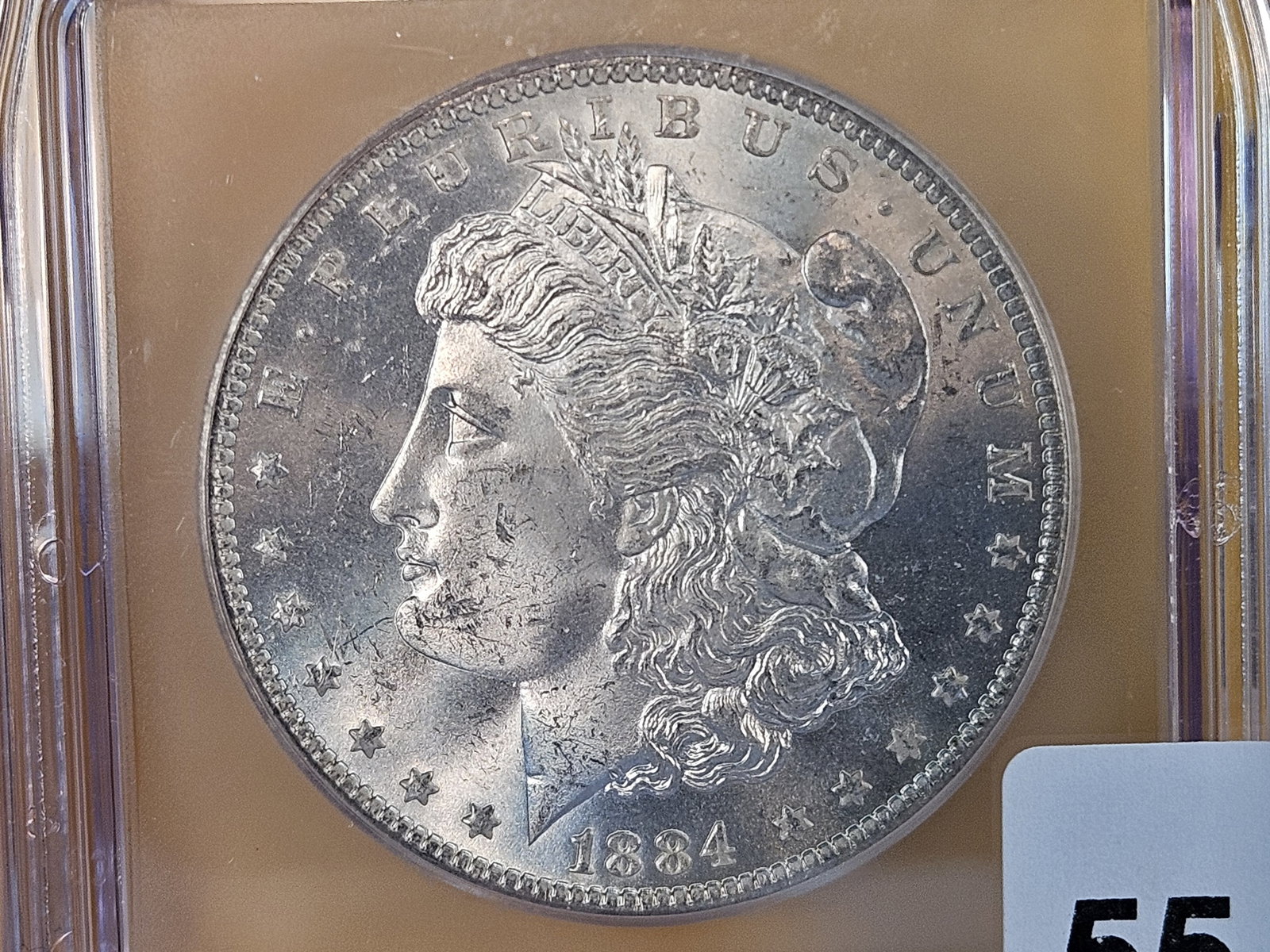 ICG 1884-O Morgan Dollar in Mint State 64: Good contrast in the fields