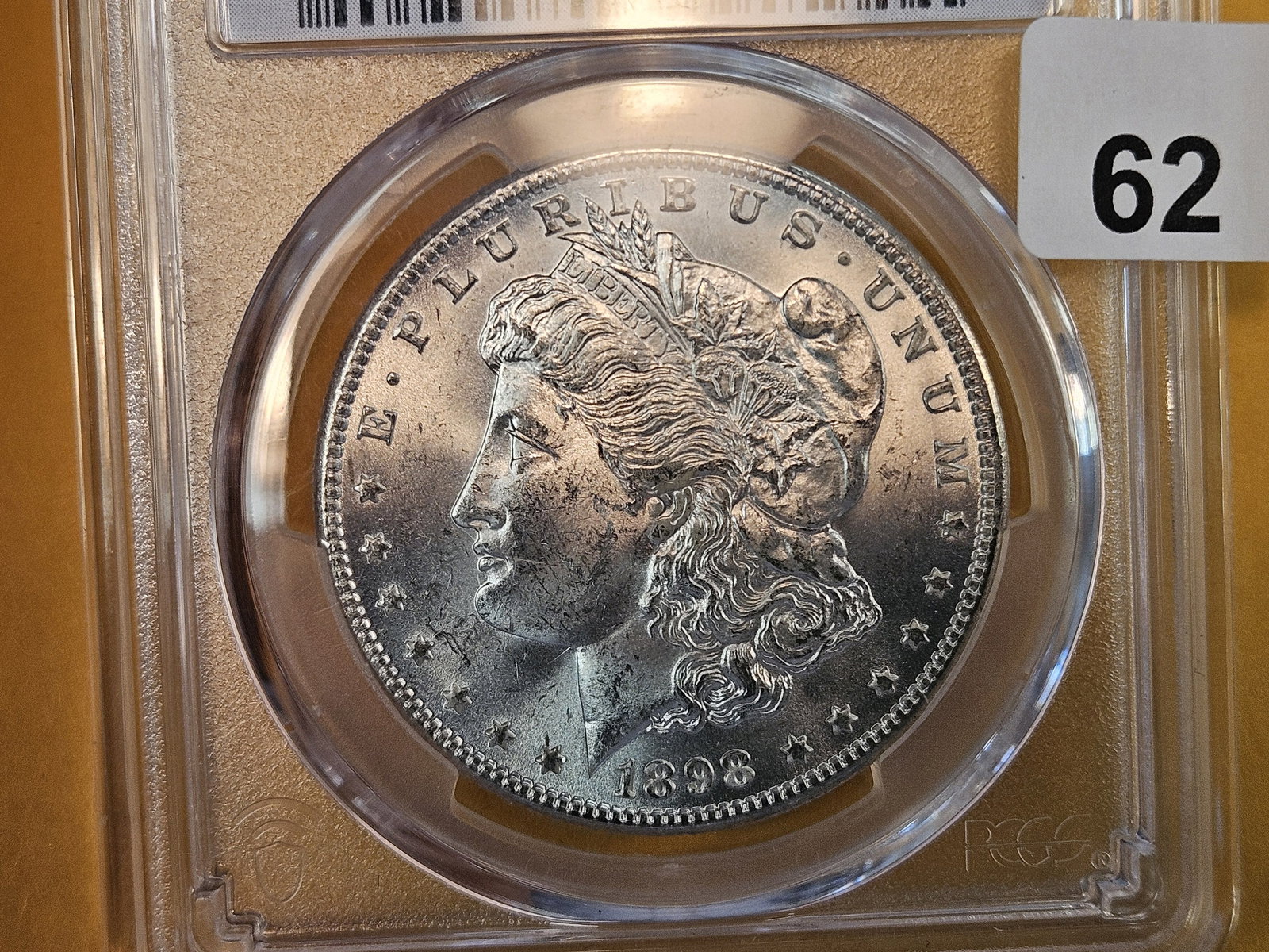 PCGS 1898-O Morgan Dollar in Mint State 63 (1 of 3)
