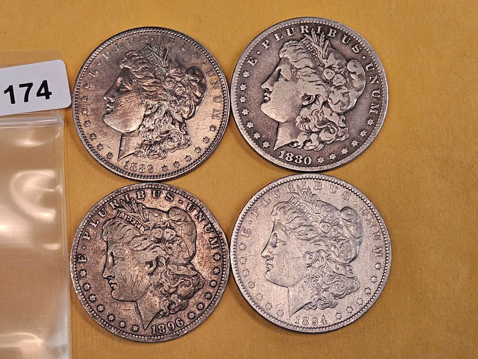 Four mixed Morgan Silver Dollars (1 of 2)