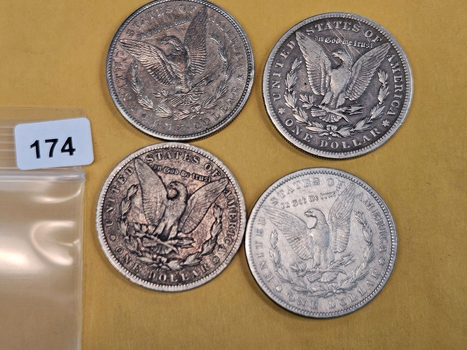 Four mixed Morgan Silver Dollars - 2
