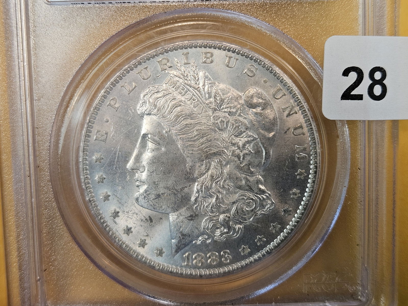 PCGS 1883-O Morgan Dollar in Mint State 63: Good contrast 