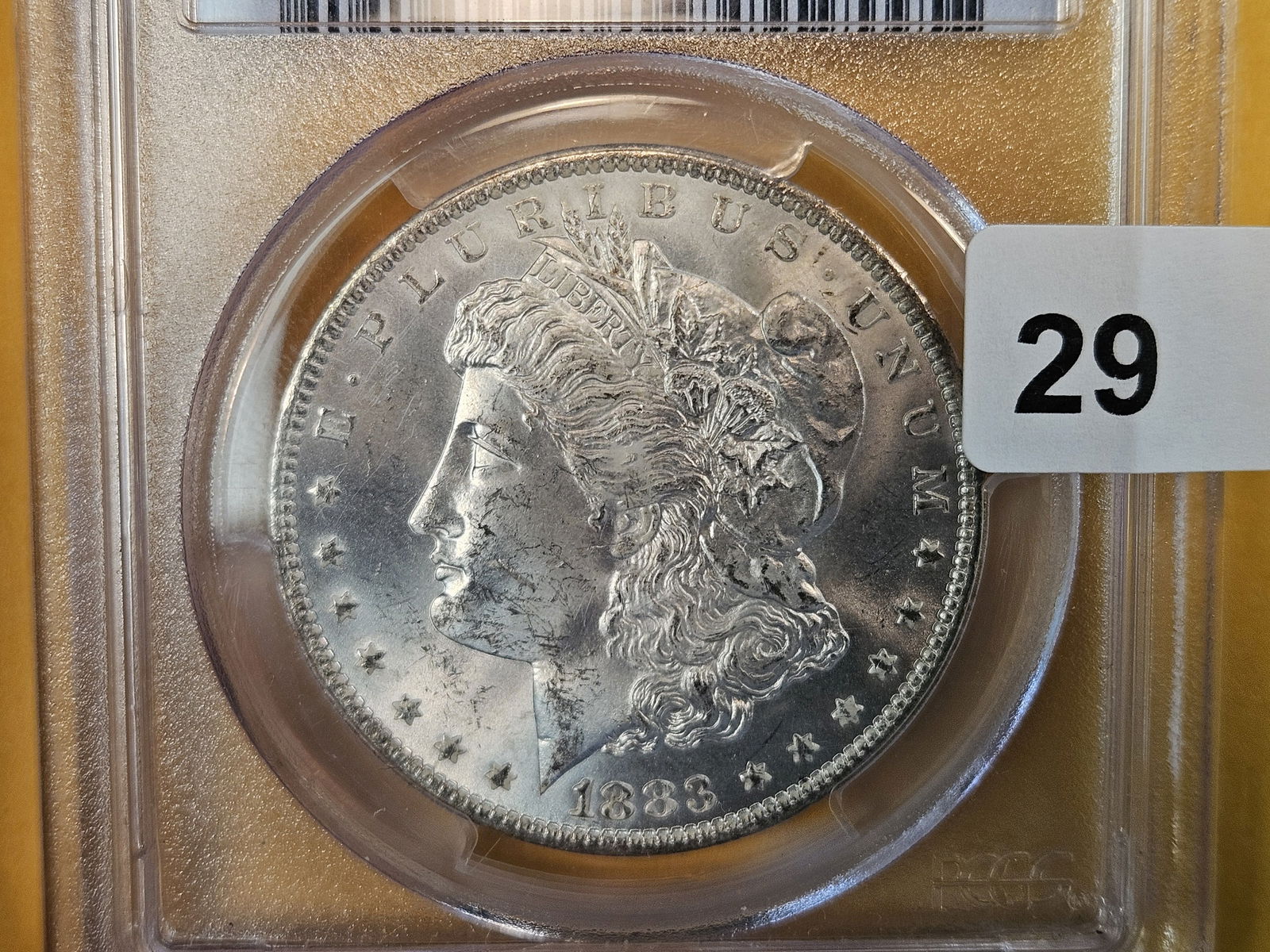 PCGS 1883-O Morgan Dollar in Mint State 63: Good reflectivity 