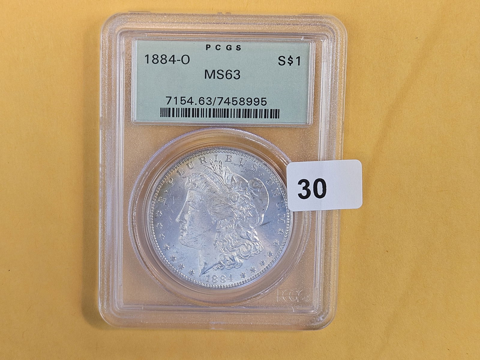 PCGS OGH 1884-O Morgan Dollar in Mint State 63 - 2