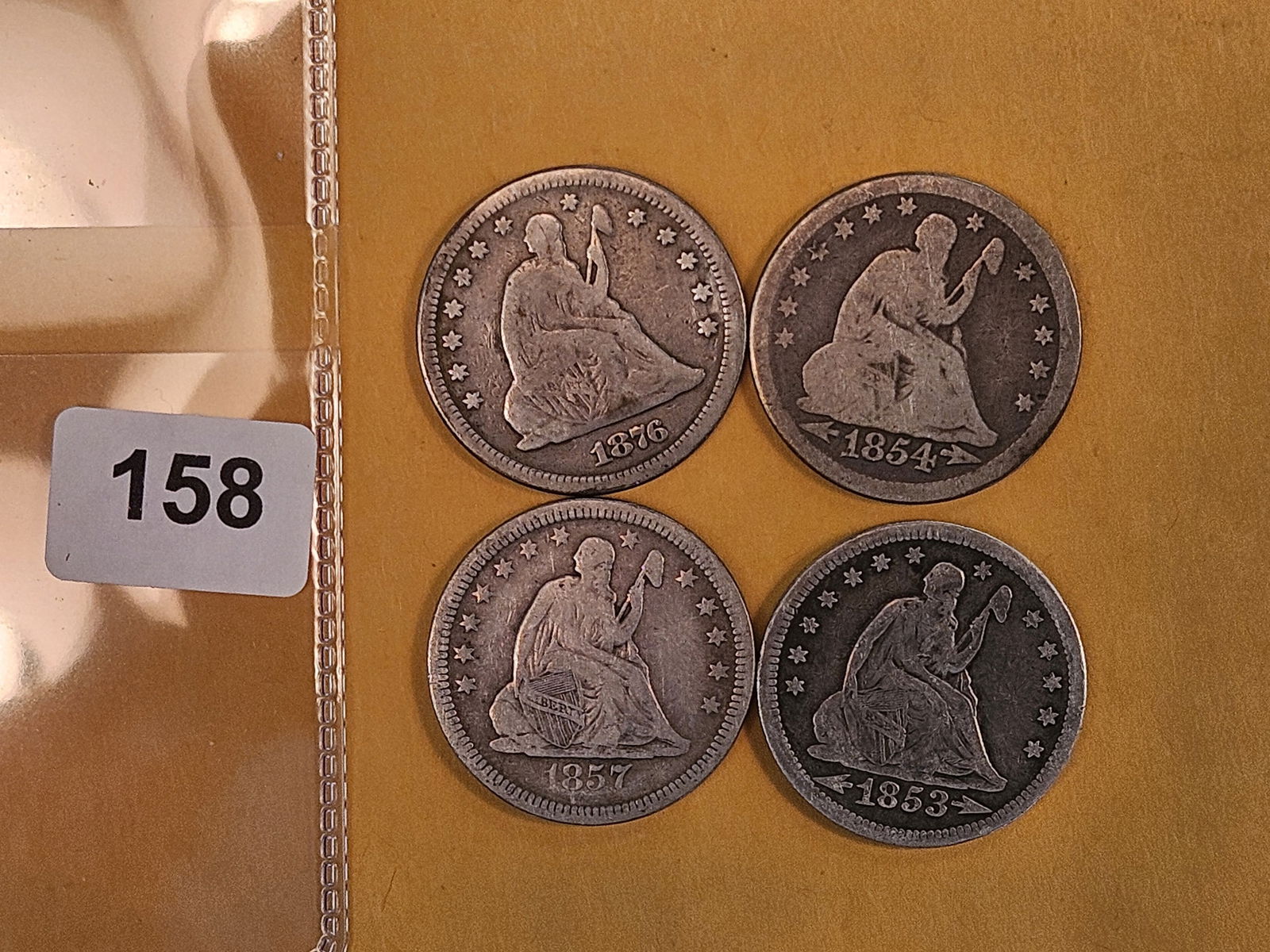 Four mixed Seated Liberty silver Quarters: In Good to Very Good plus 