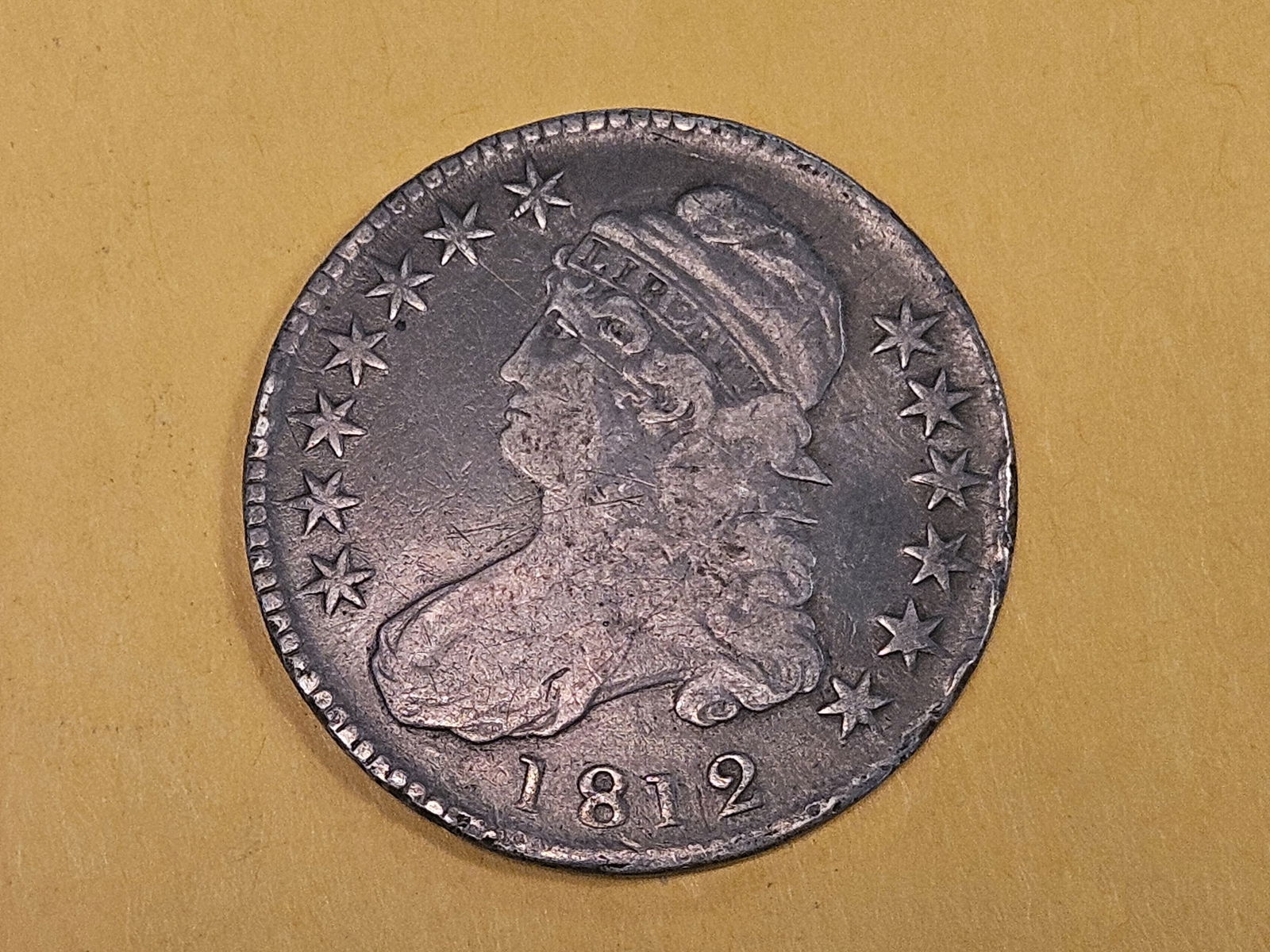 Better 1812 Capped Bust Half Dollar in Very Fine: Wasn't there some war or something going on that year?