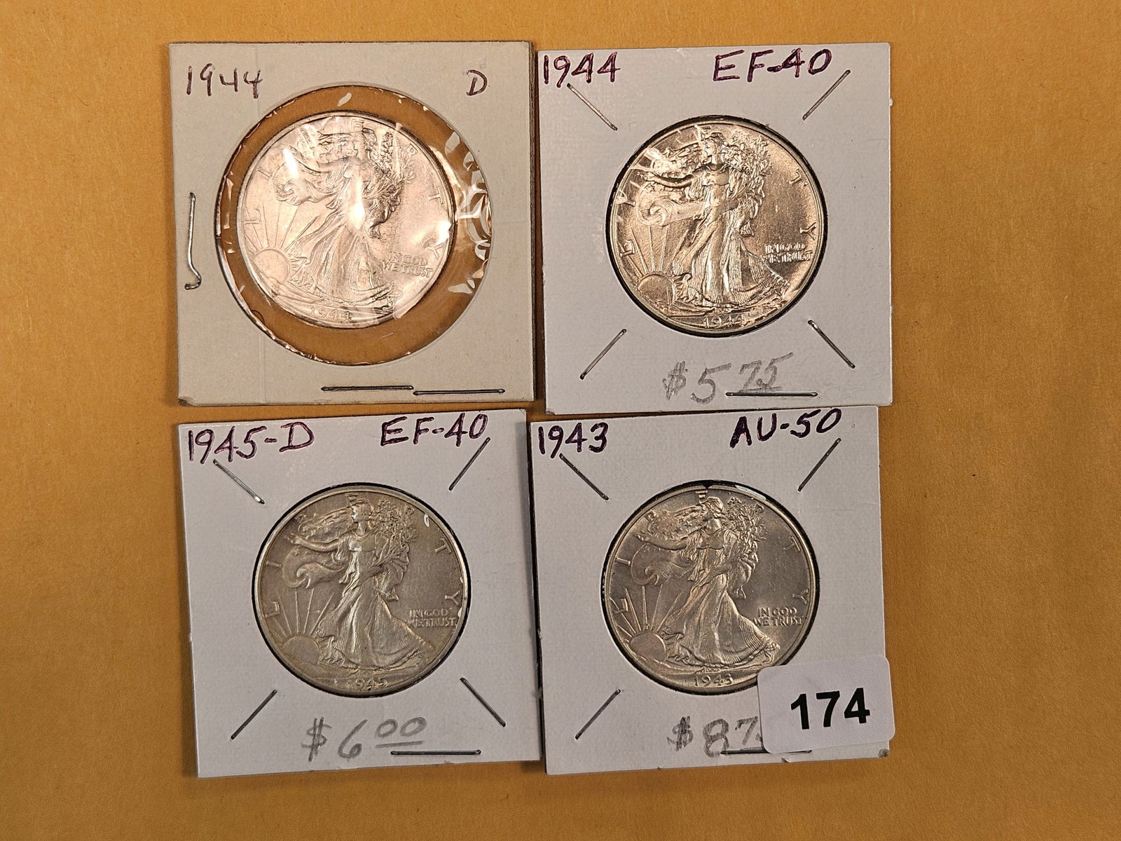 Four Bright Walking Liberty silver half dollars: All in Extra Fine plus through About Uncirculated 