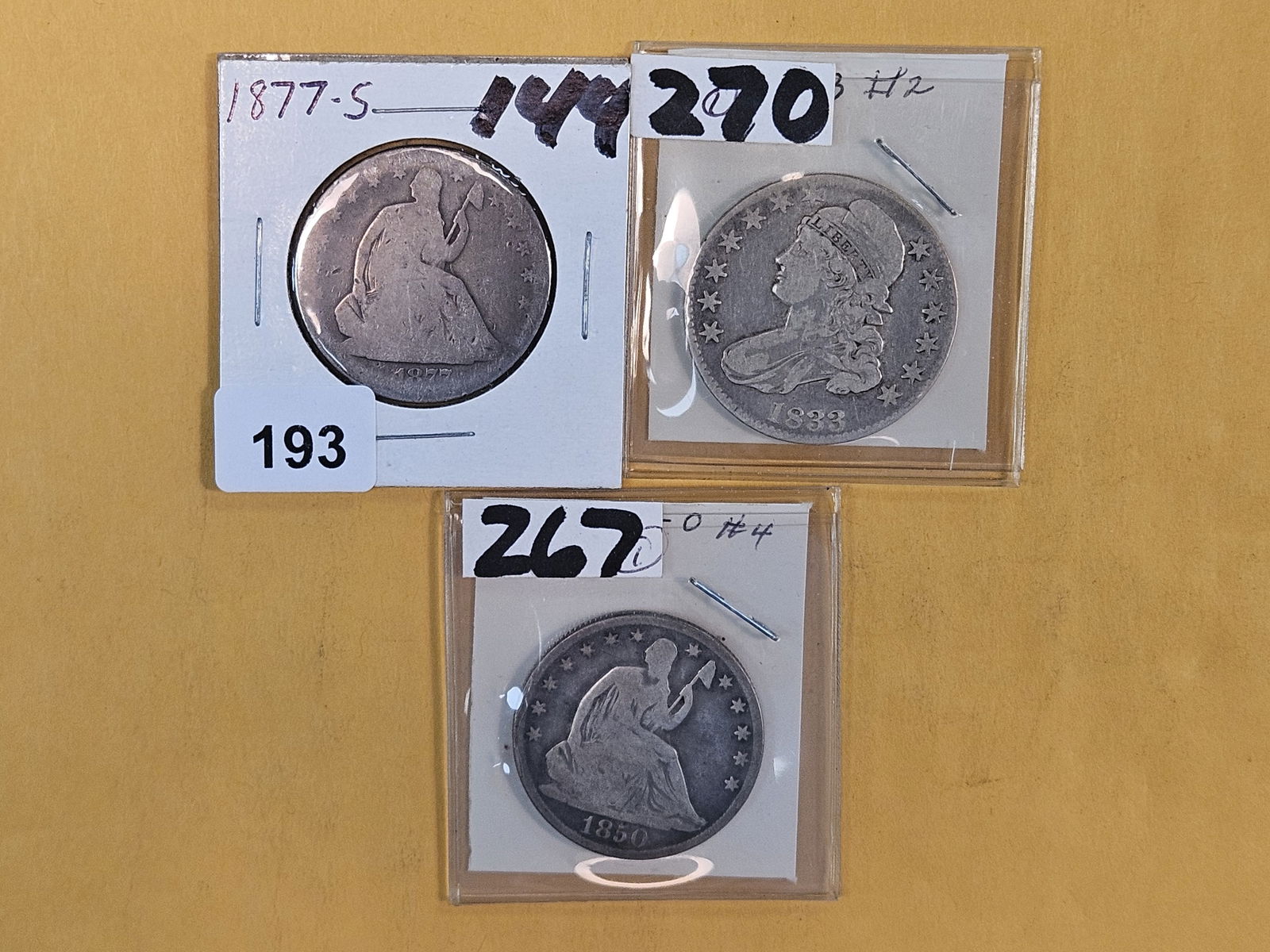 Three mixed silver half dollars: Seated and Bust 