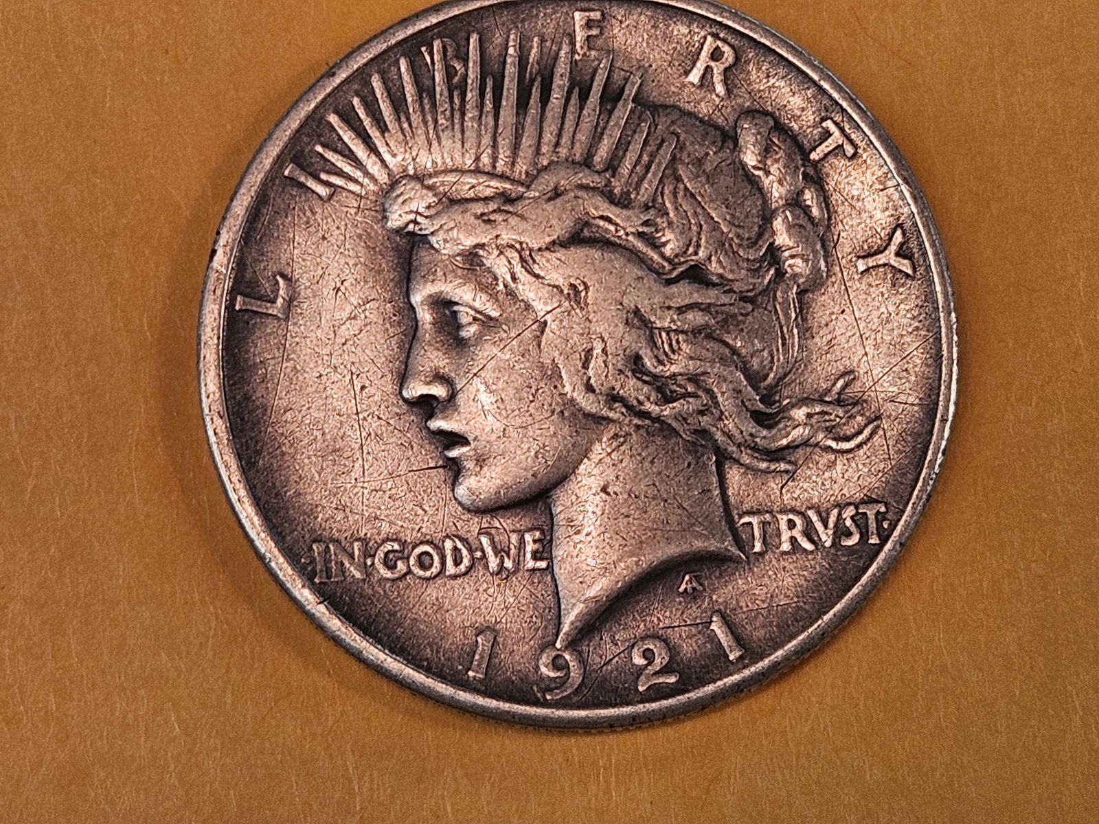 ** KEY DATE ** 1921 Peace silver Dollar in Very Fine - details: Light patina 