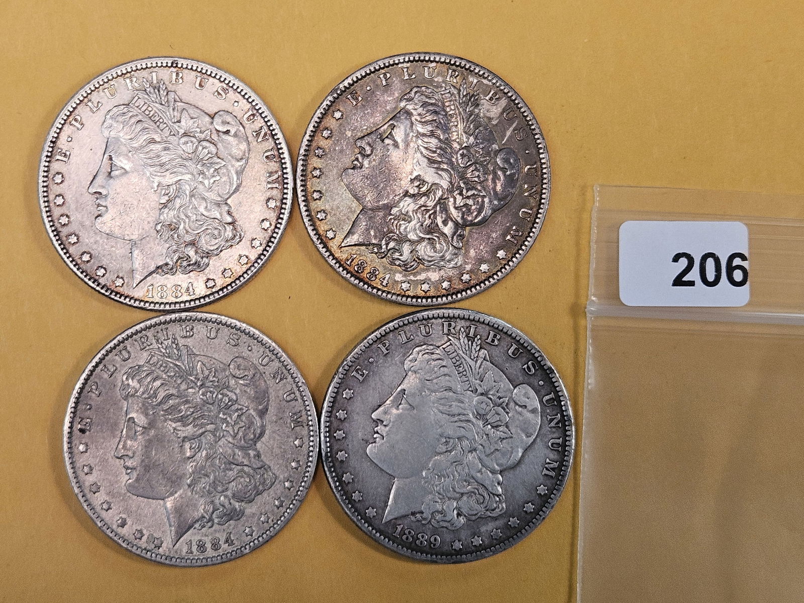 Four mixed Morgan silver Dollars (1 of 2)