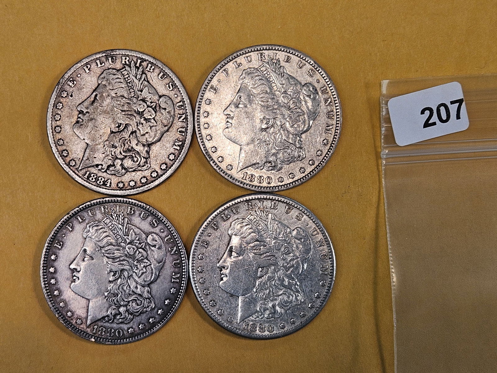 Four mixed Morgan silver Dollars (1 of 2)