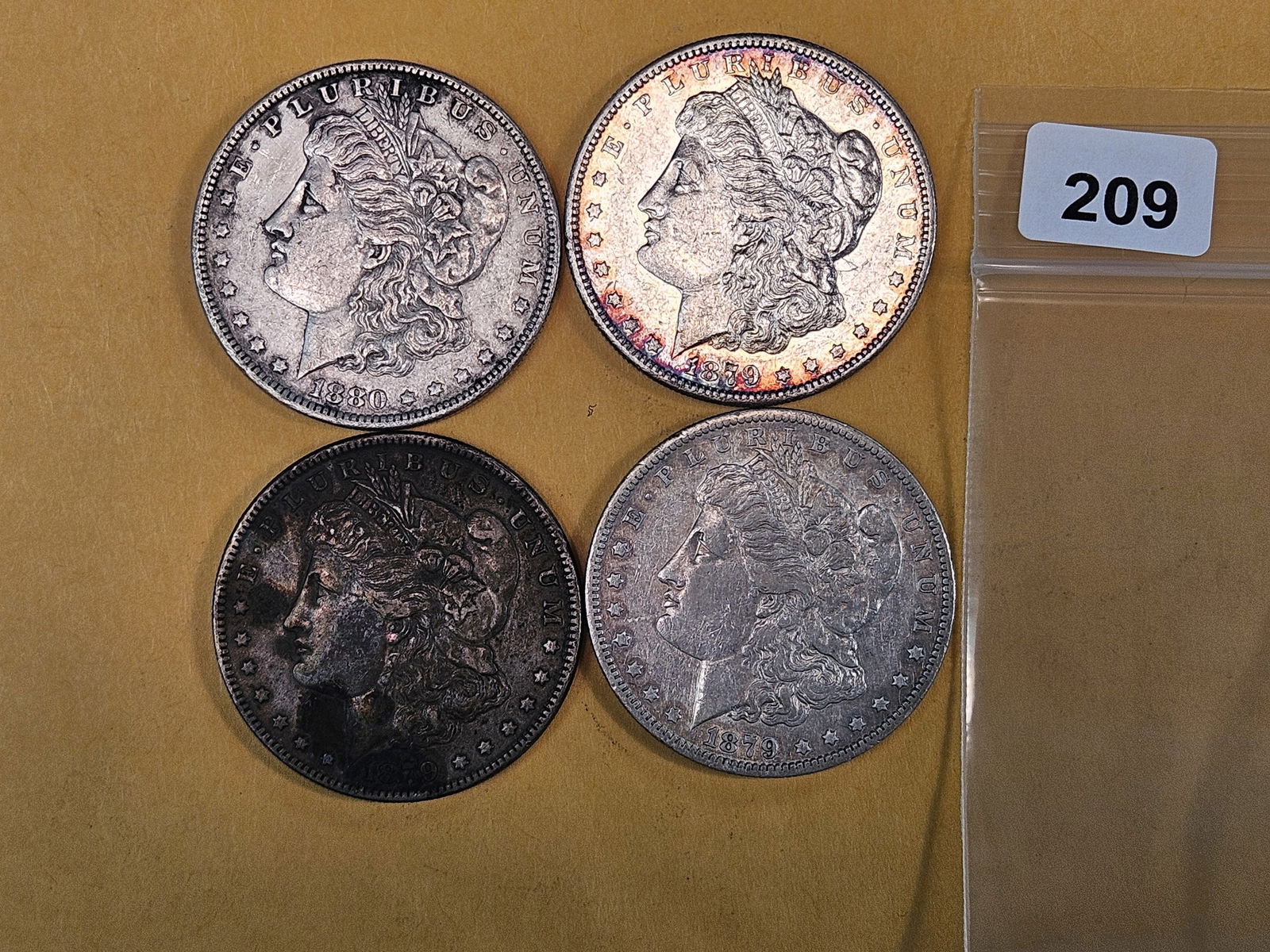 Four mixed Morgan silver Dollars (1 of 2)