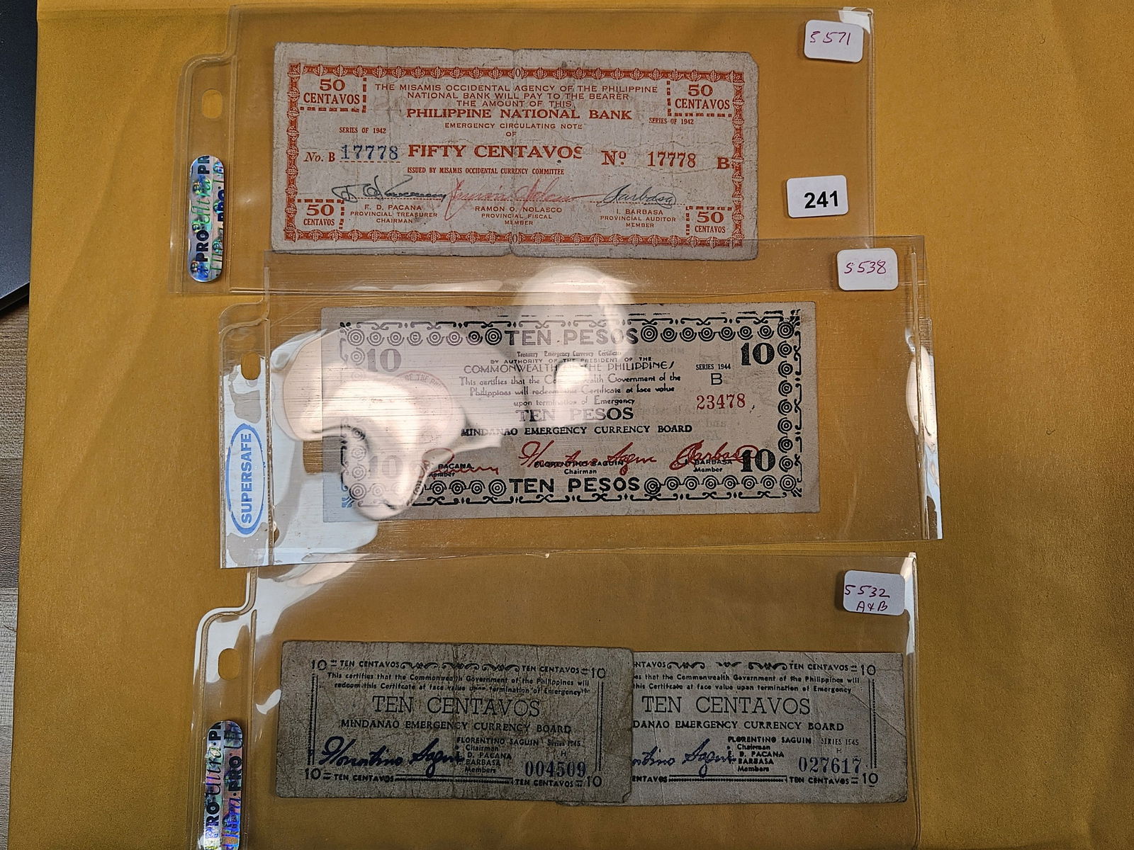 Four scarcer Philippines Notes: 50 centavos, 10 pesos and 10 centavos 