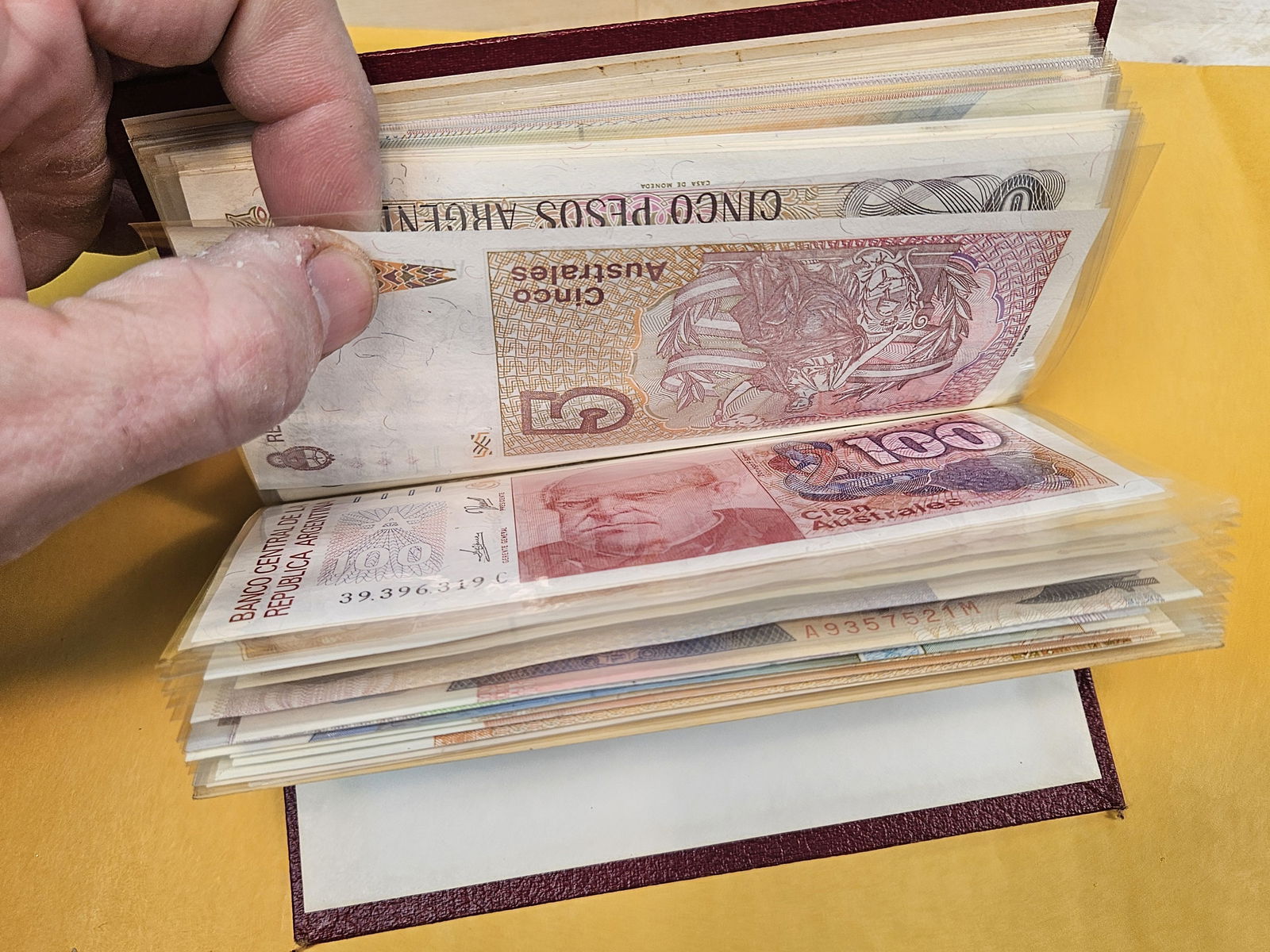 Full little booklet of mixed World currency - 12